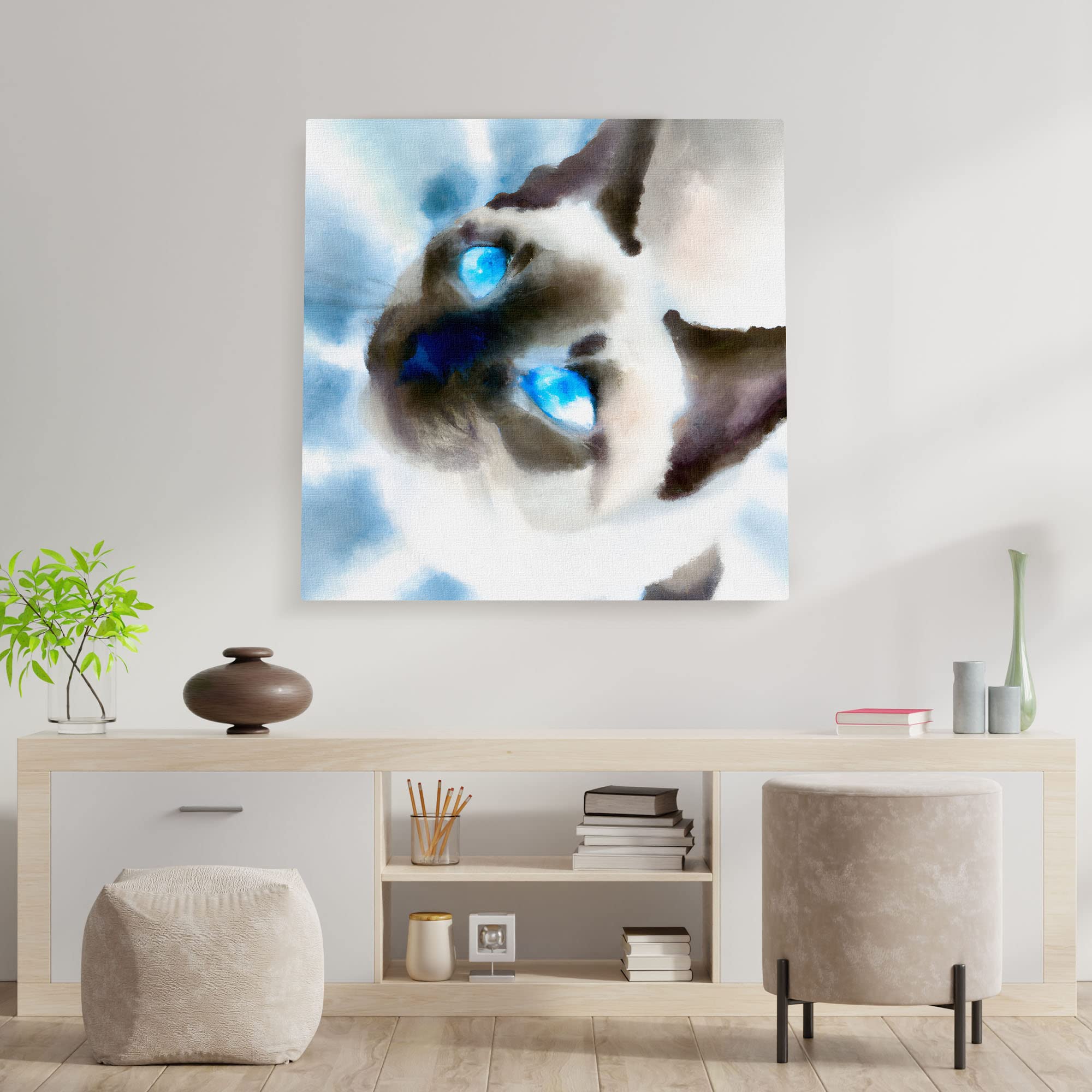 Close-up Siamese cat wall art watercolor with bright blue eyes and soft brush strokes on square canvas above modern console table