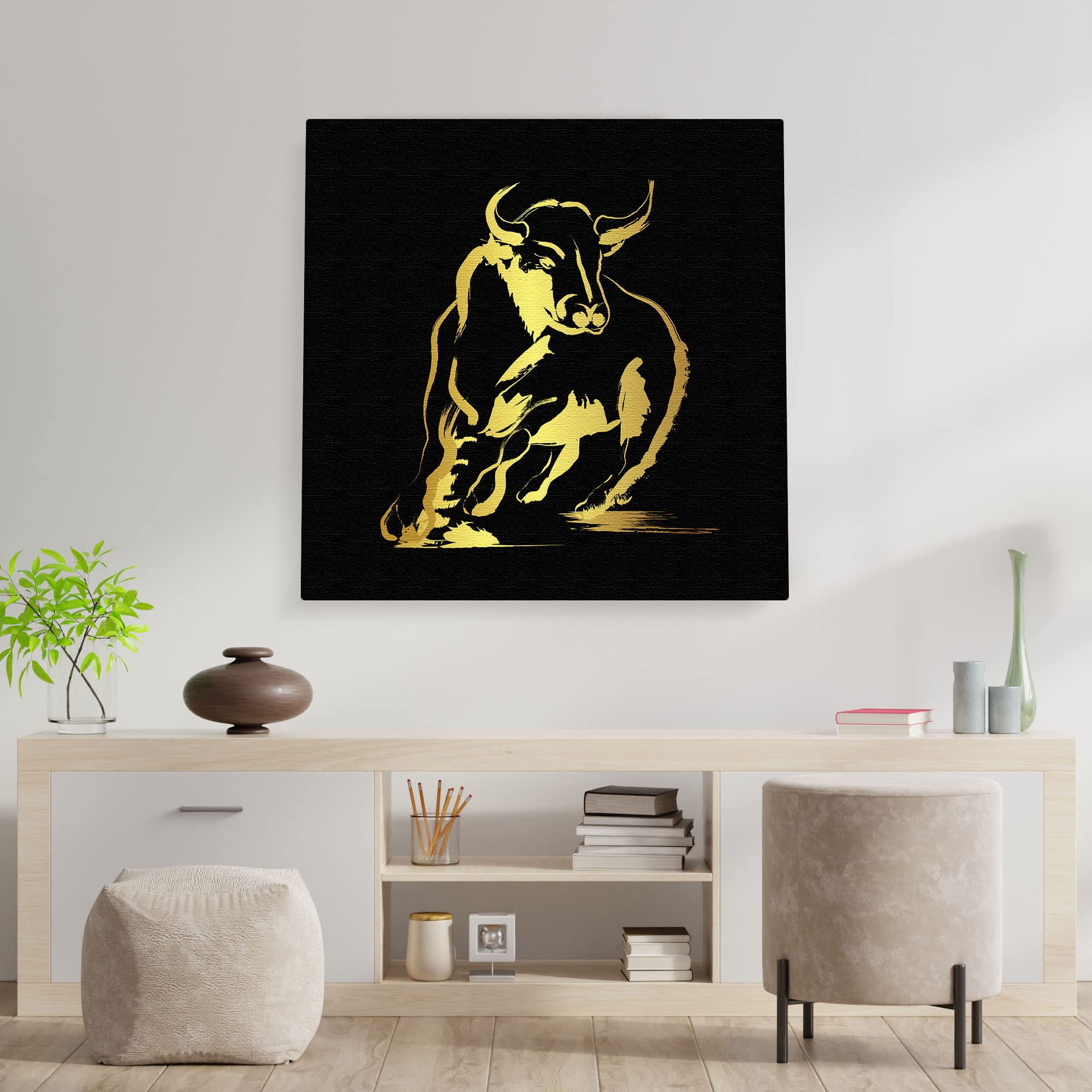 Black and gold abstract bull art with bold brushstroke design on square canvas displayed above minimalist console table