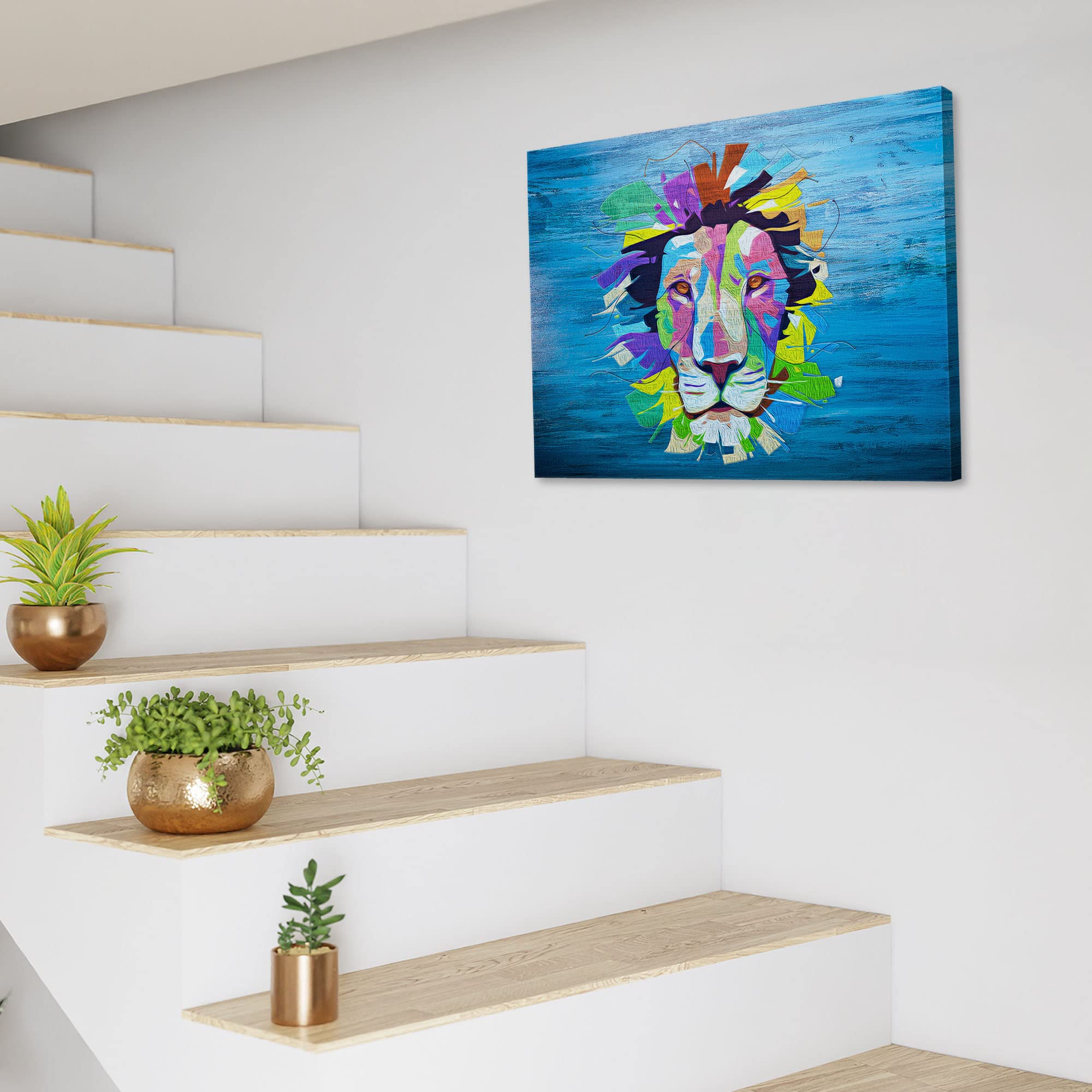 Colorful pop art lion face on blue textured canvas displayed on white wall above modern staircase with plants