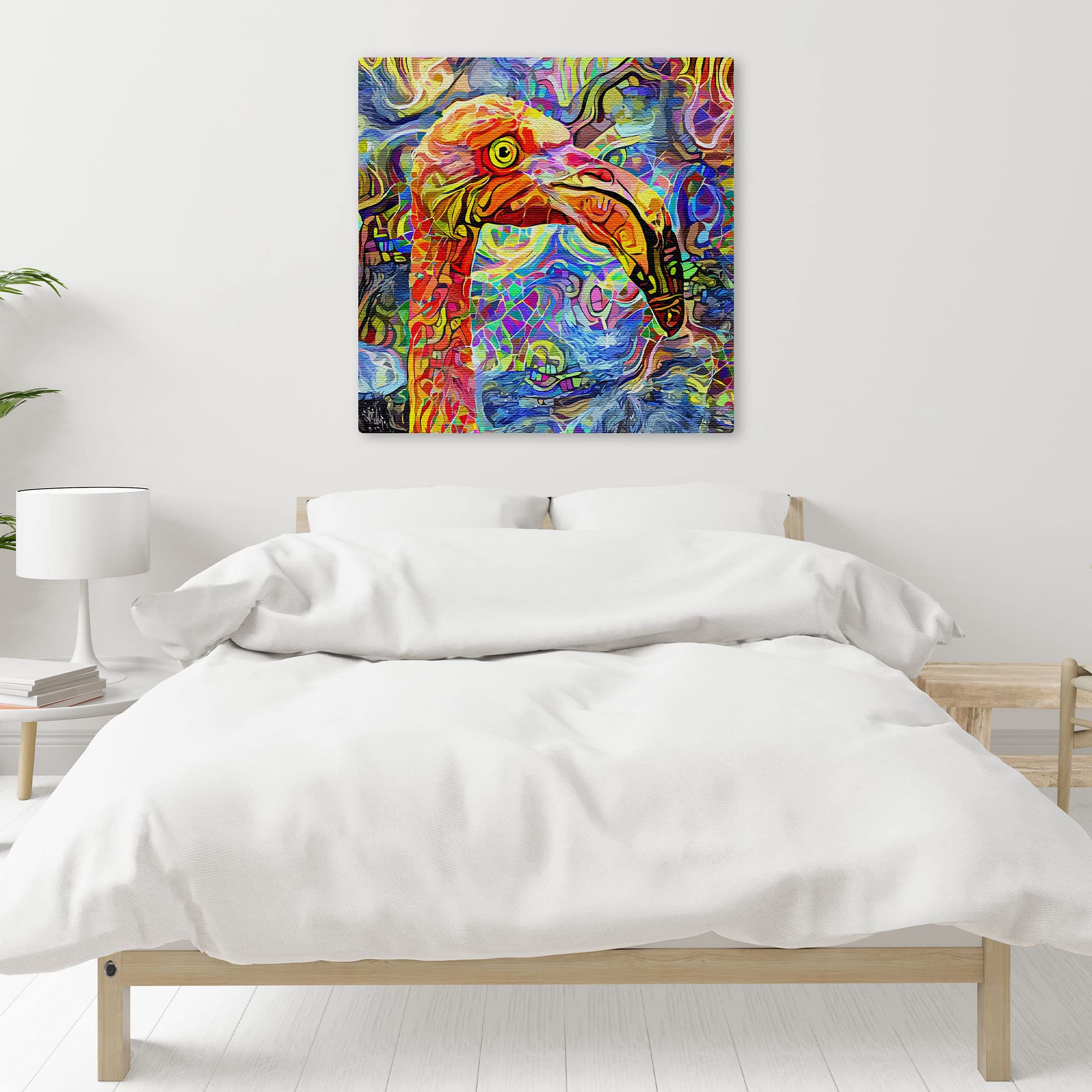 Colorful quirky abstract flamingo bird art with vivid patterns hanging on white wall above bed in modern minimalist bedroom