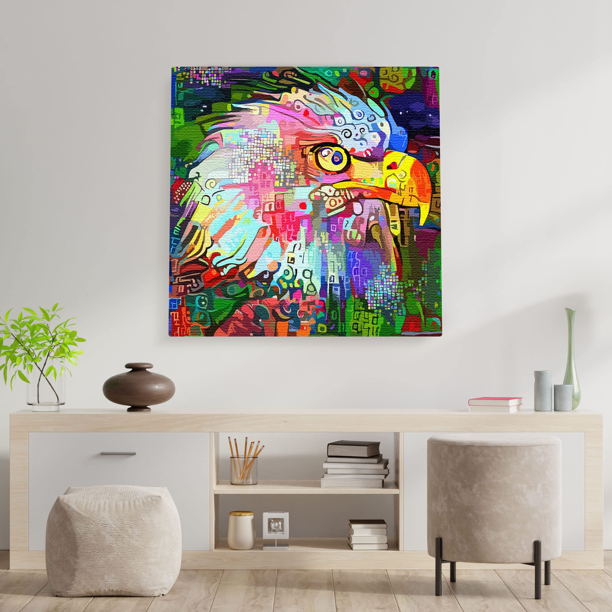 Colorful abstract eagle head wall art with vibrant geometric patterns on square canvas hanging above minimalist wooden console