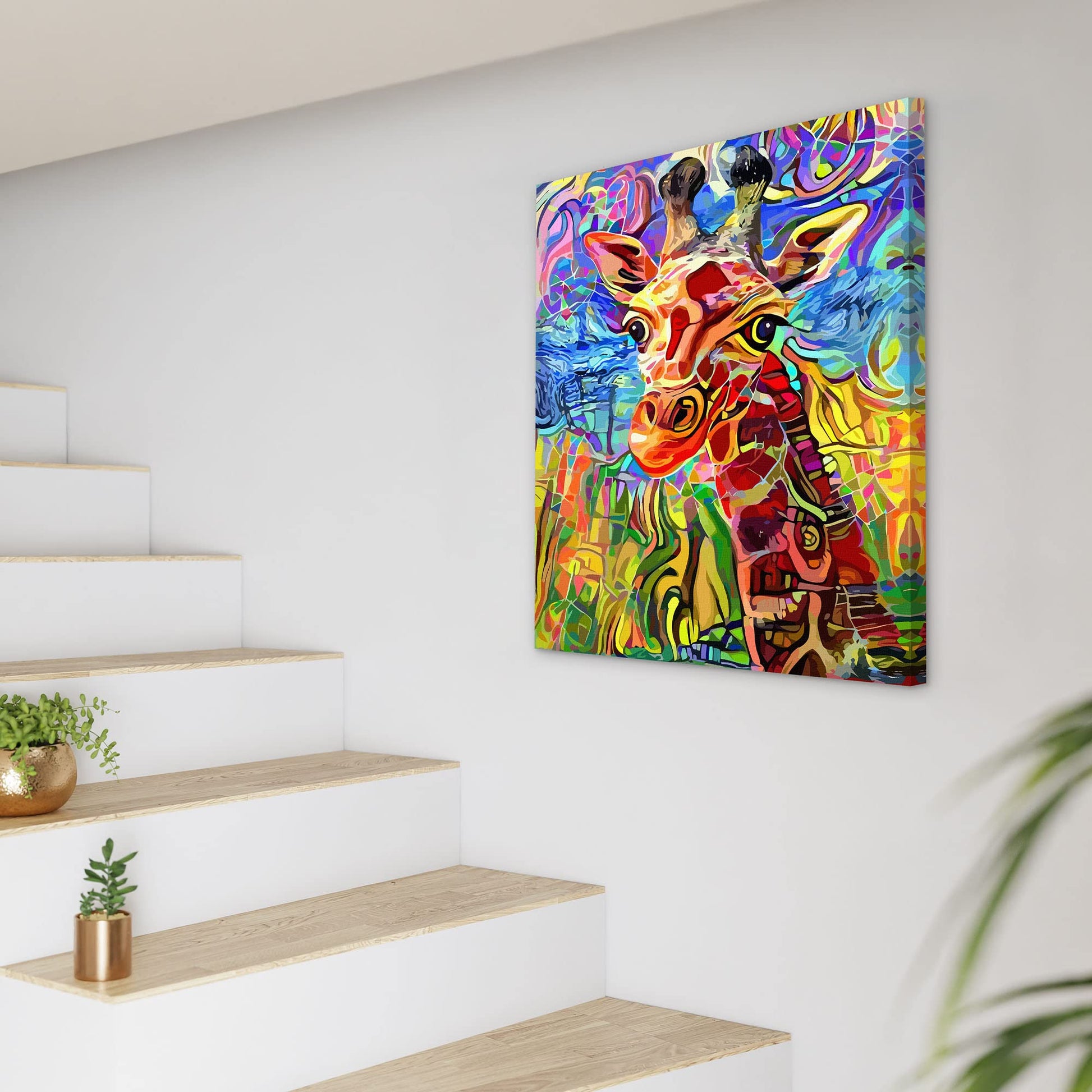 Colorful abstract giraffe portrait with vibrant patterns printed on canvas hanging on white wall by staircase