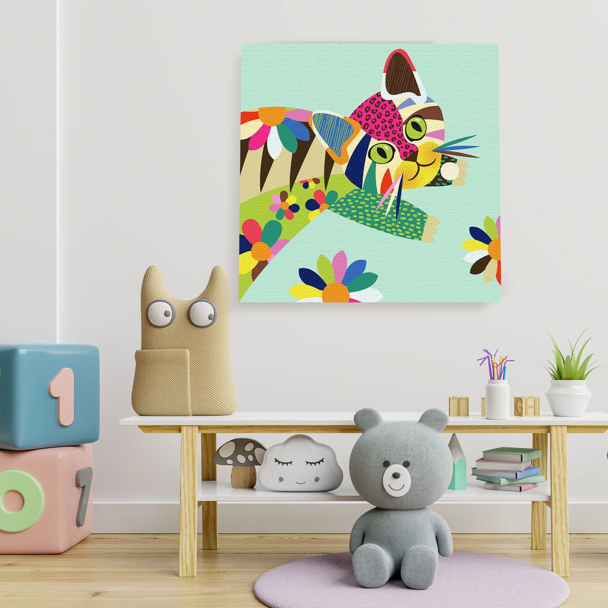 Colorful cute cat kitten wall art with vibrant geometric shapes and bold lines on pastel blue canvas in playful nursery room