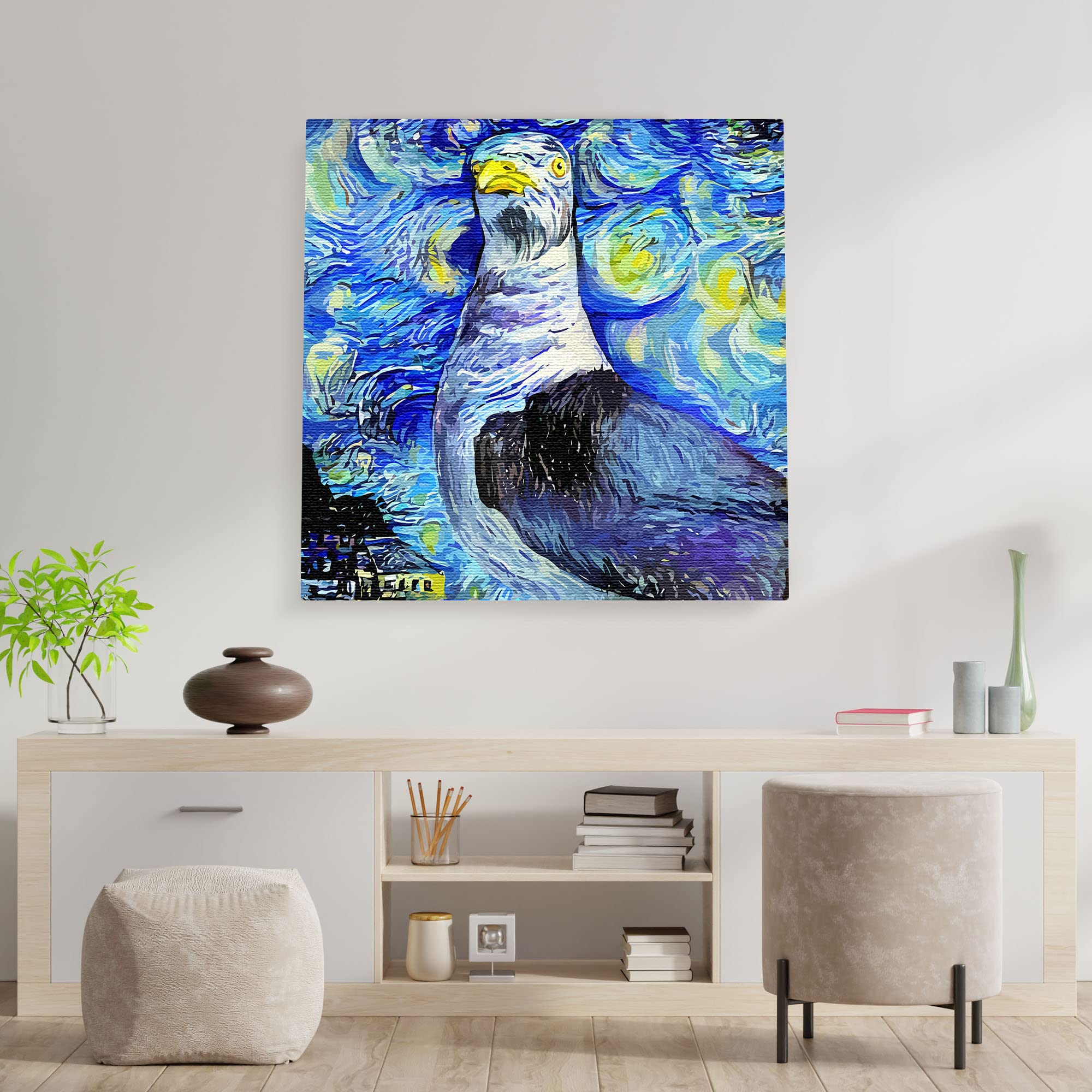 Abstract blue seagull with swirling starry night sky and vibrant patterns on square canvas wall art above modern console table
