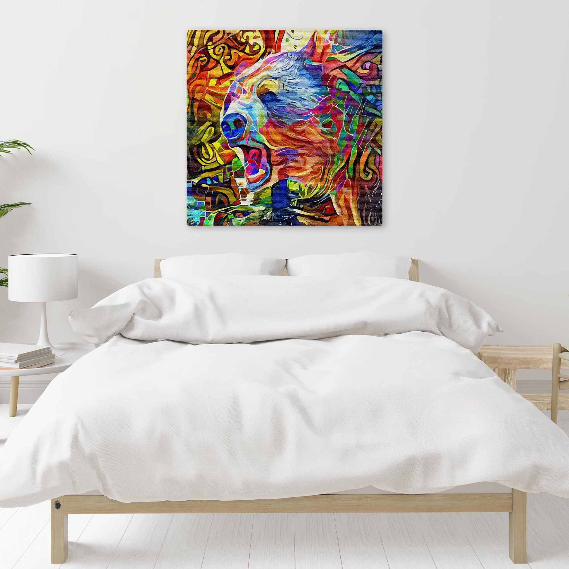 Colorful abstract grizzly brown bear artwork with vibrant reds, blues, greens, and yellows in swirling mosaic patterns above bed