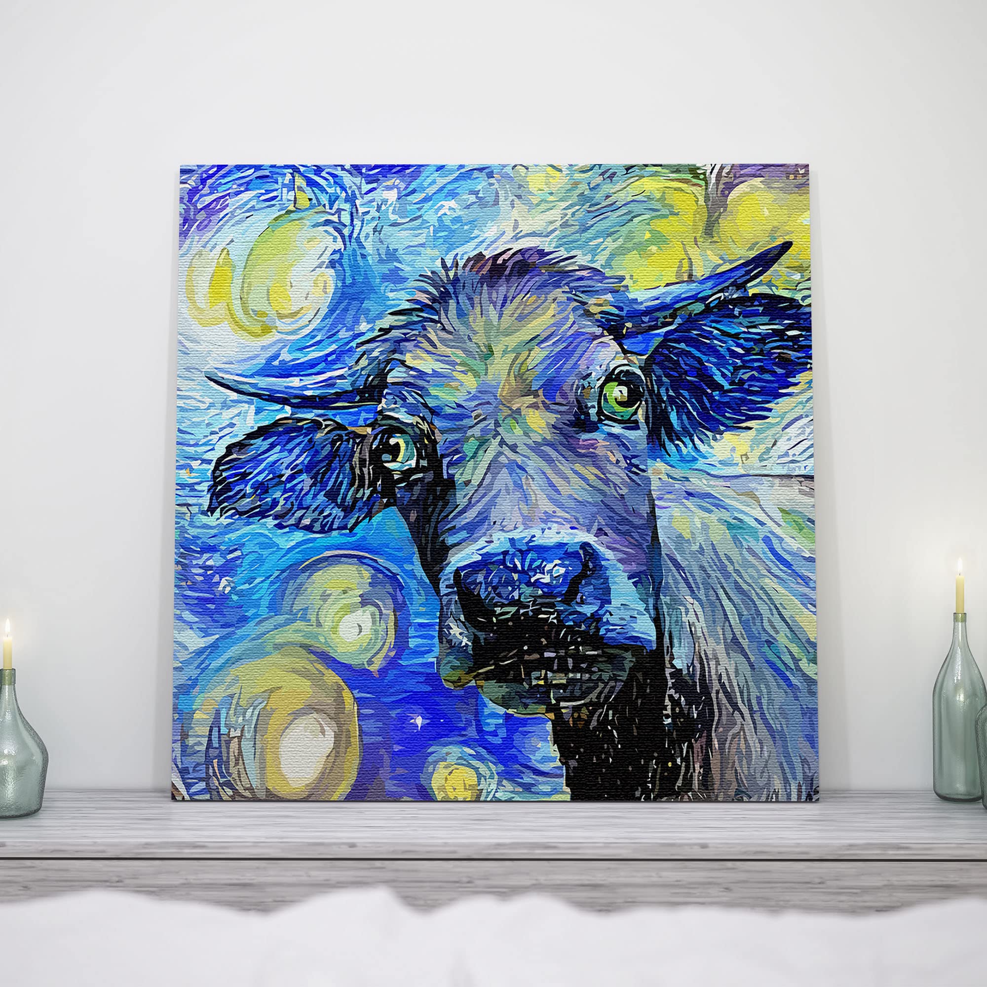 Blue abstract cow painting with expressive swirling brushstrokes on square canvas displayed on mantel with candles