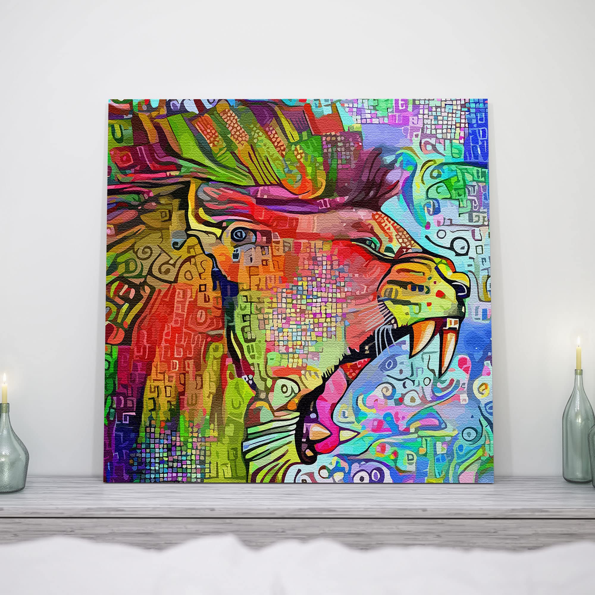 Colorful abstract roaring lion artwork on square canvas displayed on white wall above light gray wooden surface with candles