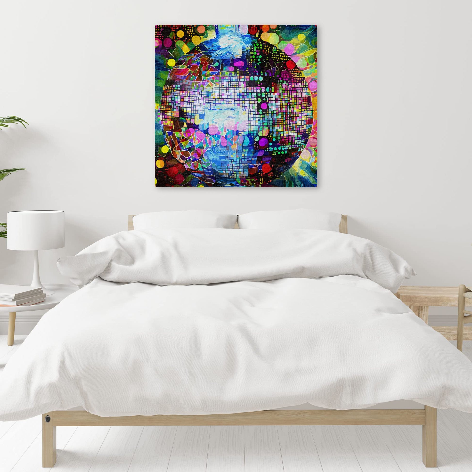 Colorful abstract disco ball wall art with vibrant geometric mosaic patterns on square canvas hanging above bed in minimalist bedroom