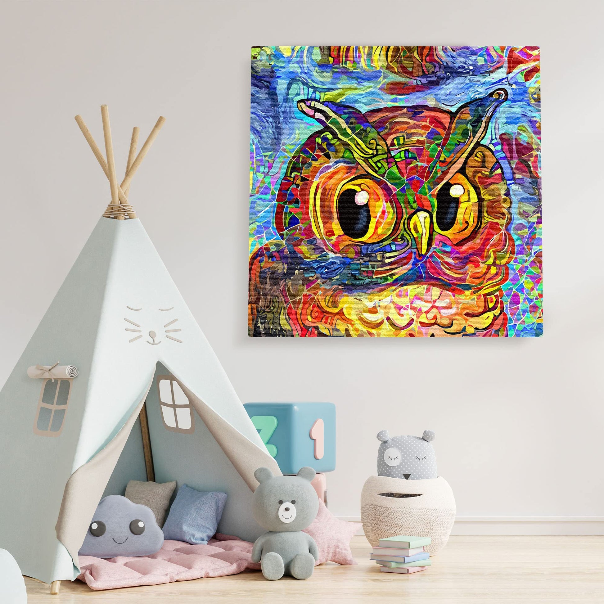 Vibrant colorful abstract owl with swirling patterns on square canvas wall art in playful children's room setting