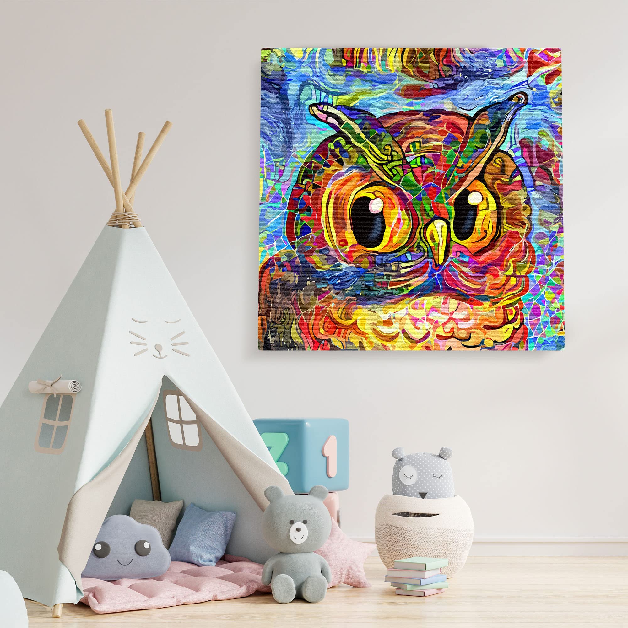 Vibrant colorful abstract owl with swirling patterns on square canvas wall art in playful children's room setting