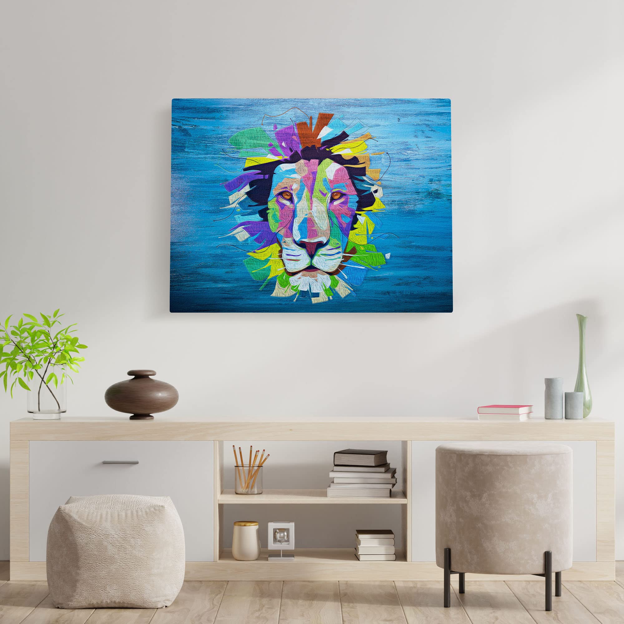 Vibrant pop art lion artwork on blue canvas displayed on white living room wall above modern wooden console with plants and decor