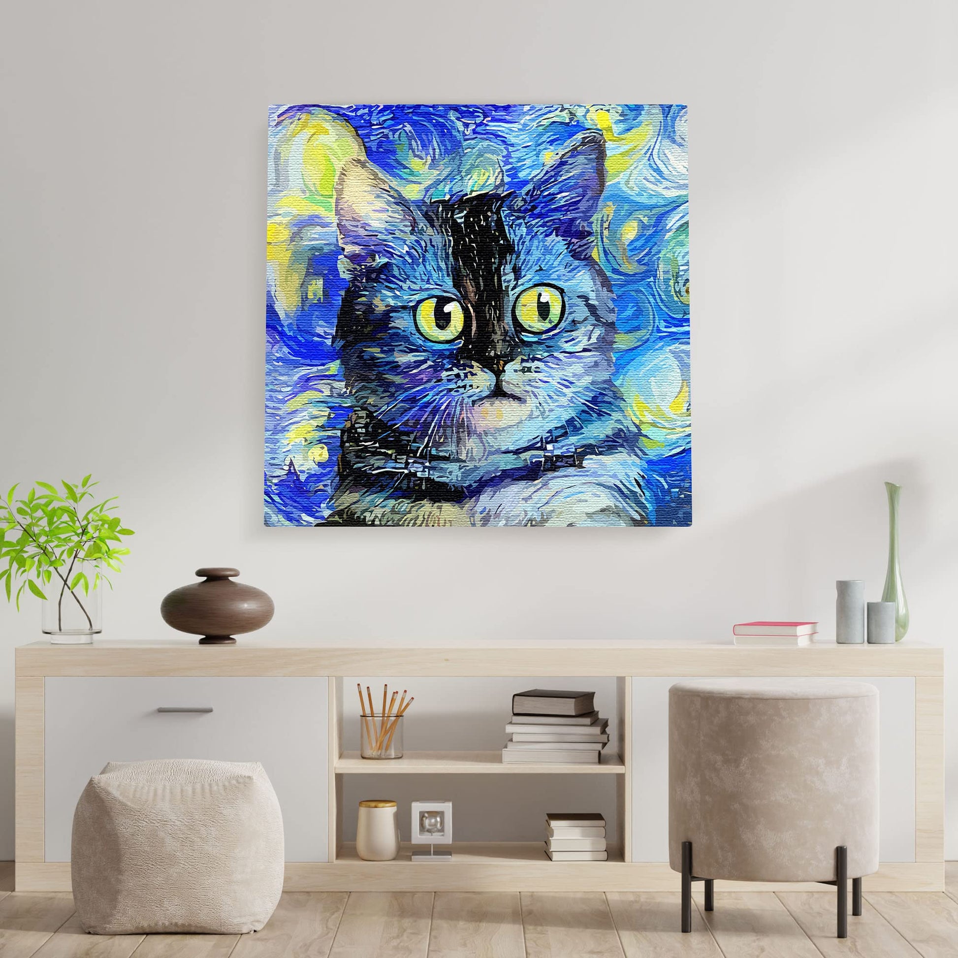 Blue impressionist cat art with swirling brushstrokes and bright yellow eyes displayed on white wall in minimalist living room