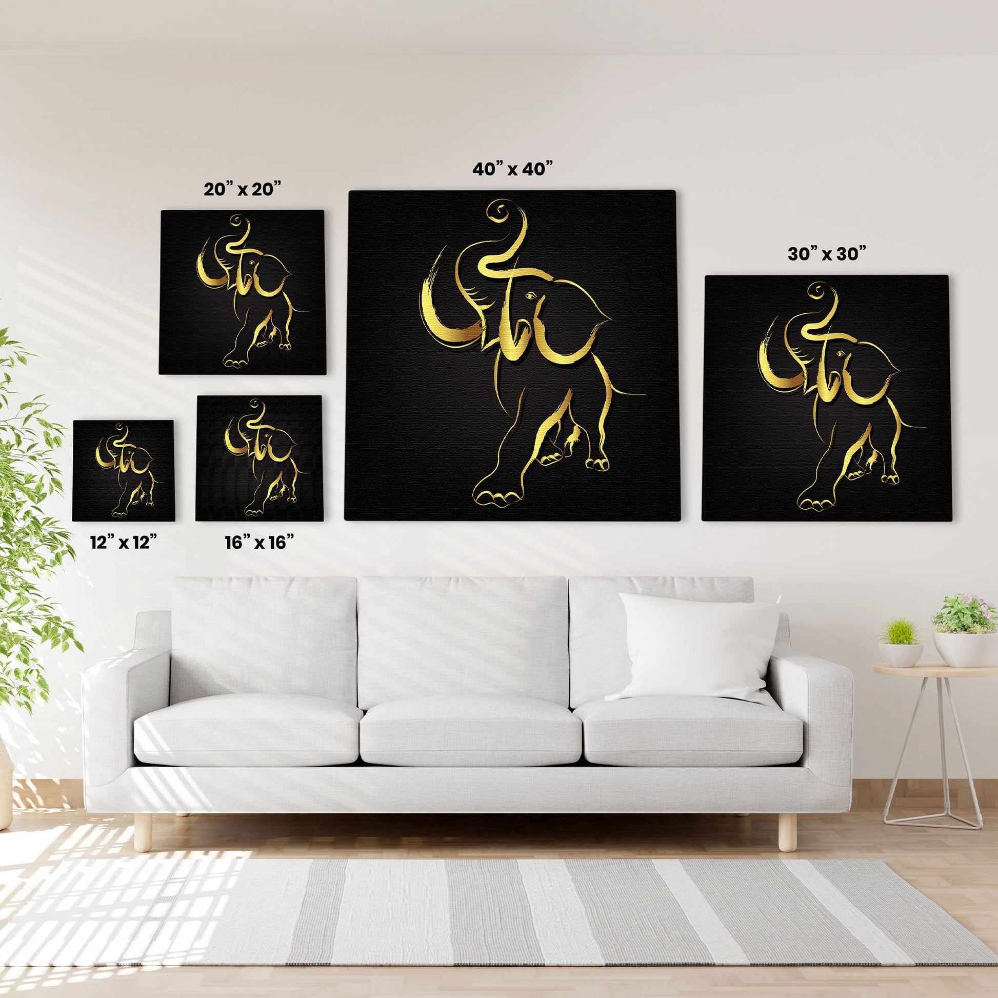Abstract black and gold elephant art in five canvas sizes displayed above white sofa in modern living room with natural light