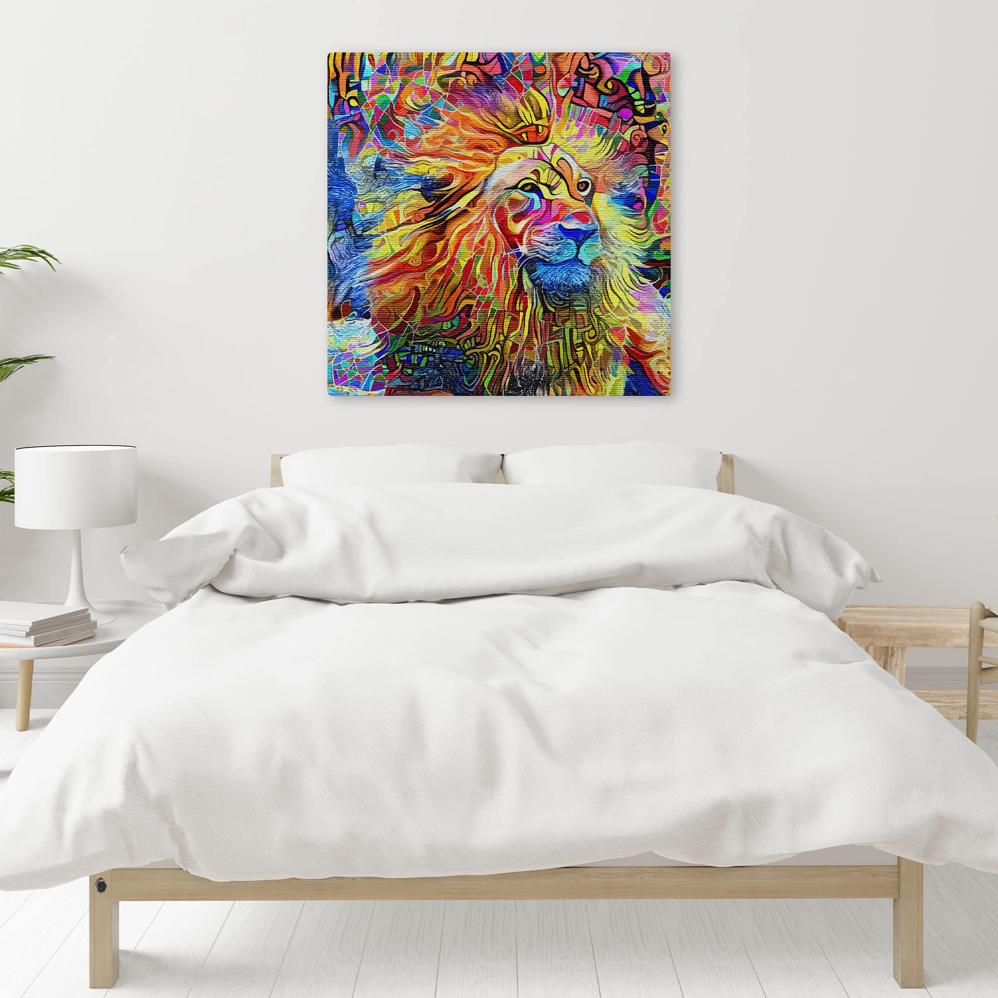 Vibrant colorful abstract lion artwork on square canvas displayed on white bedroom wall above minimalist wooden bed with white bedding