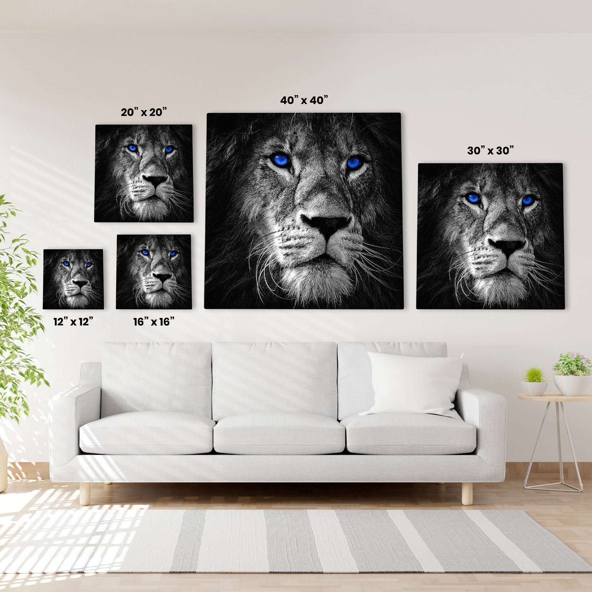 5 sizes of black and white lion face with vivid blue eyes printed on canvas displayed above white sofa in bright living room