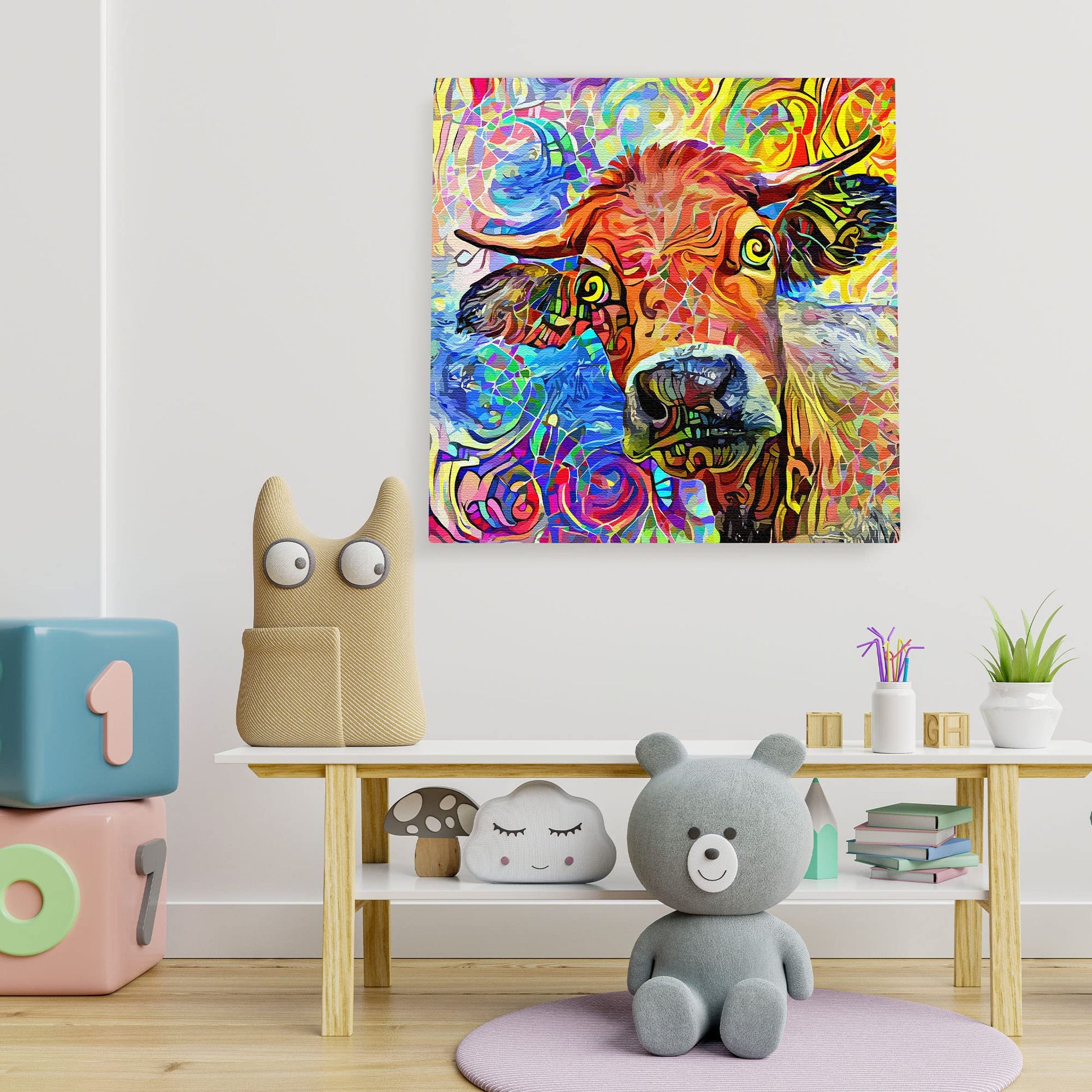 Colorful abstract cow painting with vibrant swirls and patterns on square canvas displayed in modern children's playroom