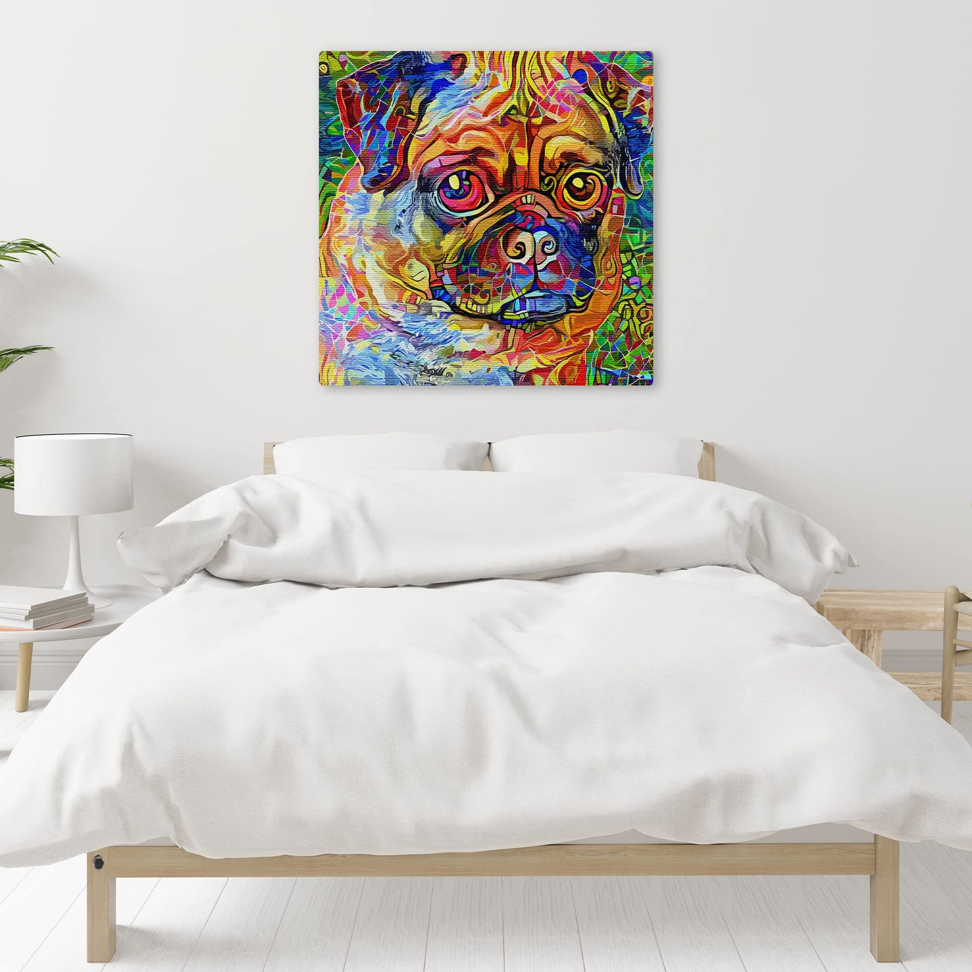 Colorful abstract pug dog wall art with vibrant multicolor geometric and mosaic patterns on square canvas above bed with white bedding