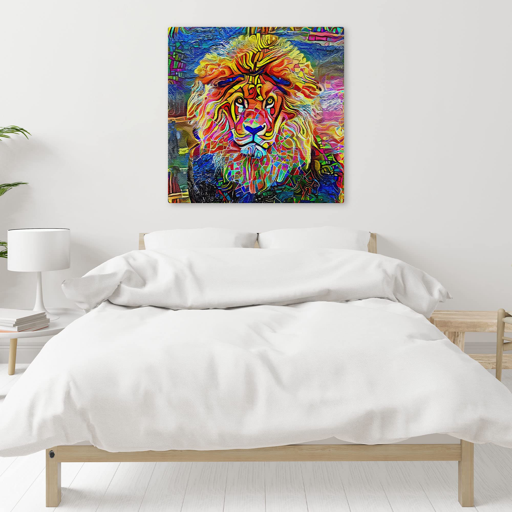 Colorful abstract lion face wall art with vibrant geometric patterns on textured canvas above minimalist bed in bright room