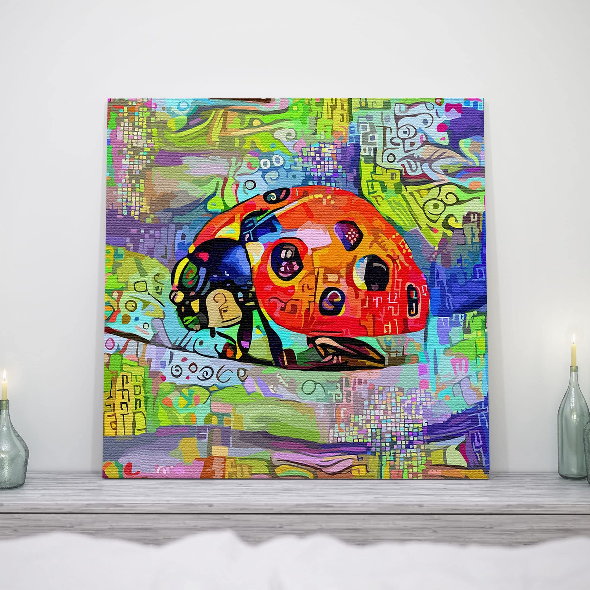Abstract ladybug wall artwork with vibrant multicolor geometric patterns on textured canvas in bright modern decor setting