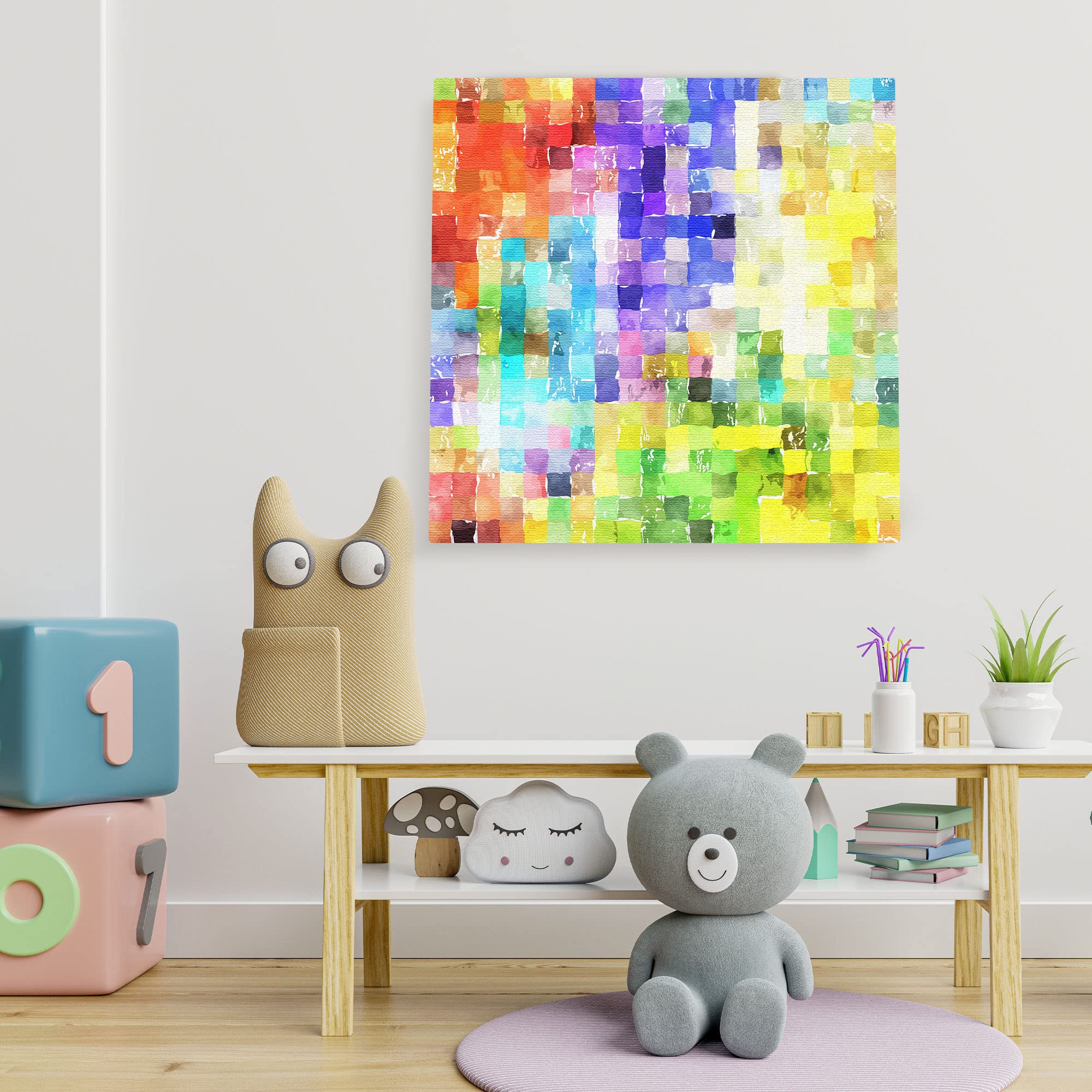 Colorful abstract watercolor mosaic wall art on square canvas in playful children's room with toys and books