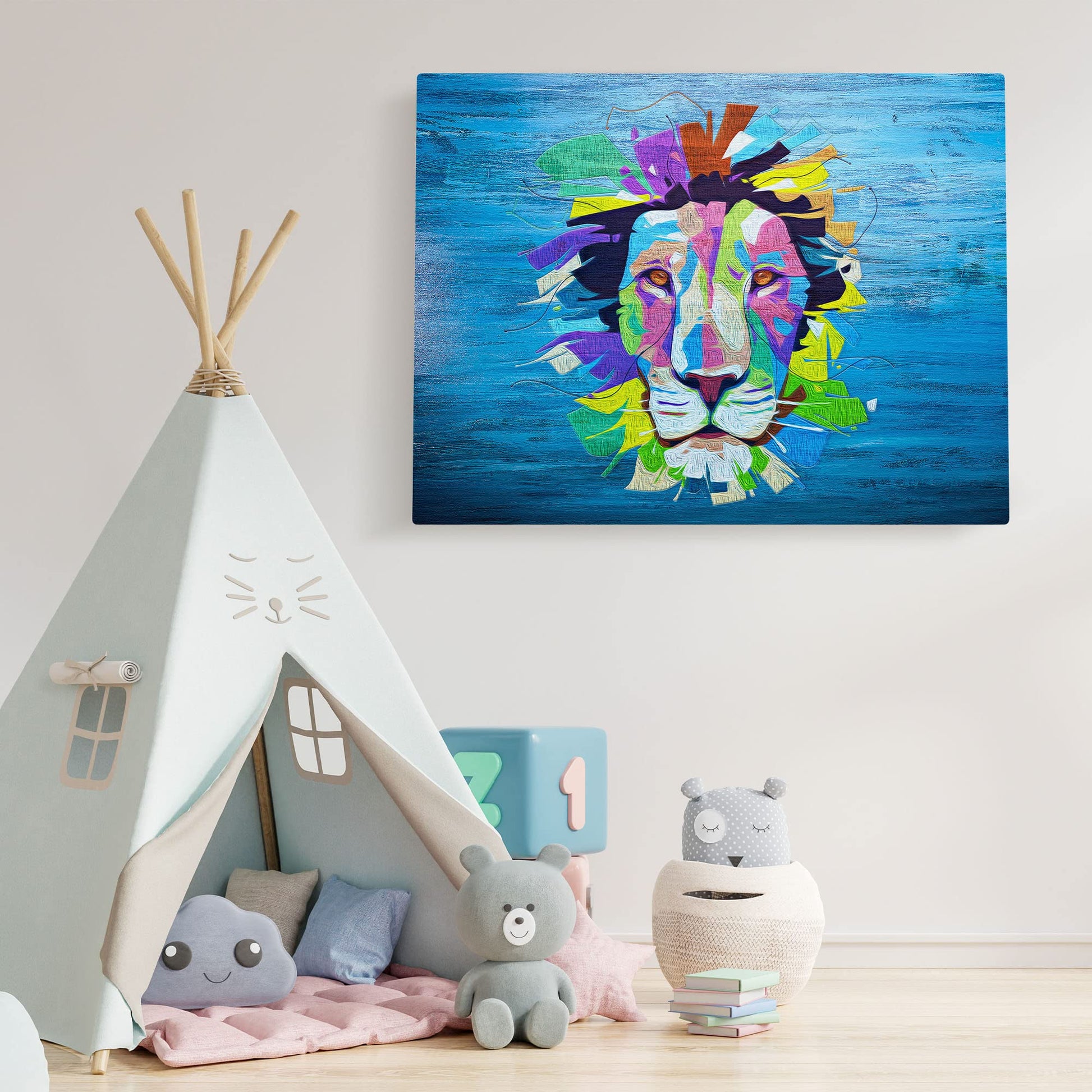 Colorful pop art lion face artwork on blue textured canvas displayed on white wall above cozy kids play tent with plush toys and decor