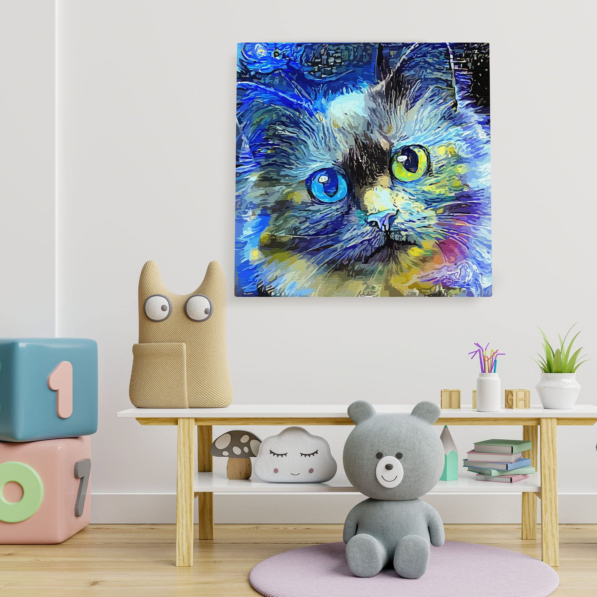 Blue cat canvas art with vibrant abstract brushstrokes and multicolored eyes displayed in playful kids room setting