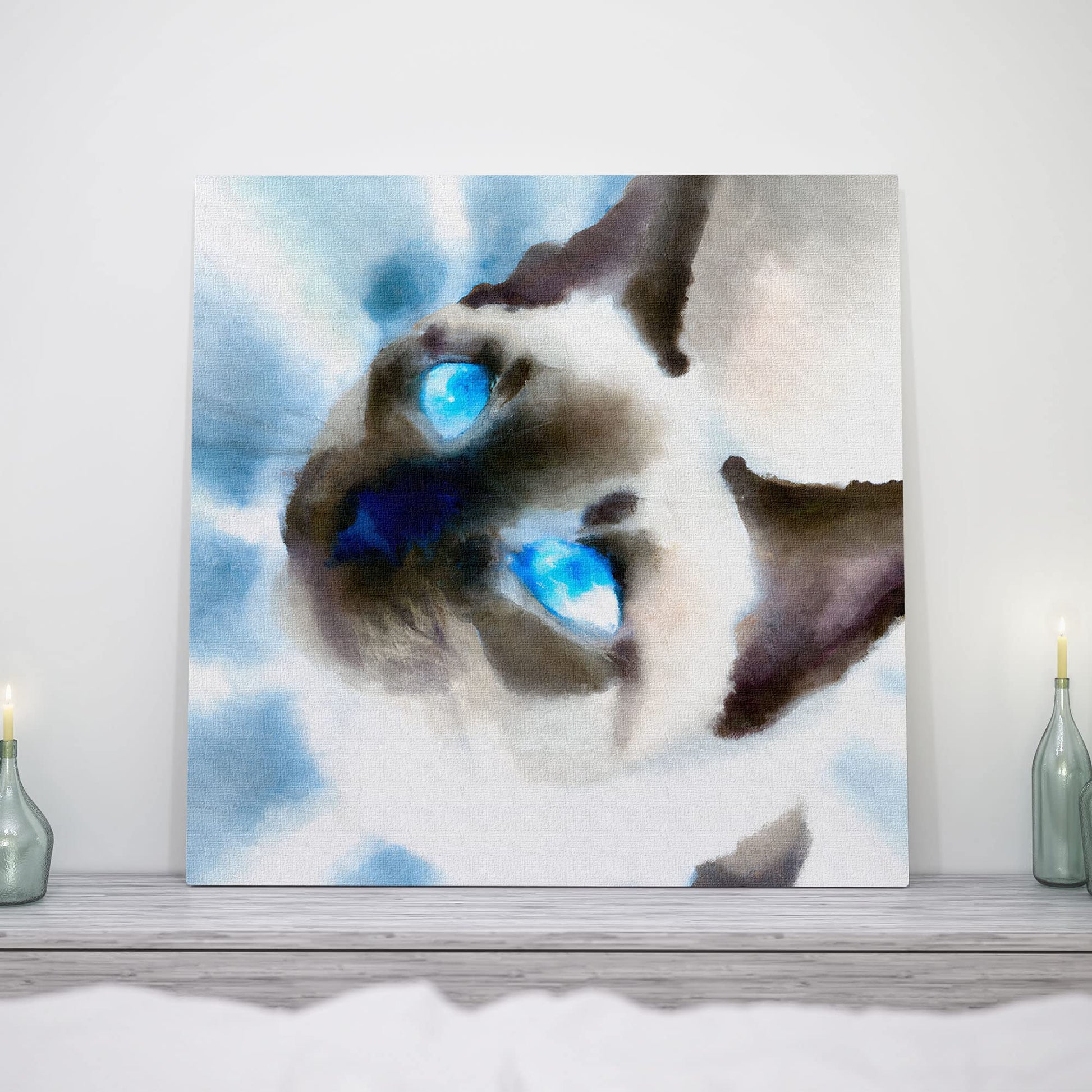 Close-up Siamese cat wall art watercolor with glowing bright blue eyes and soft blended brush strokes on square canvas on wooden shelf