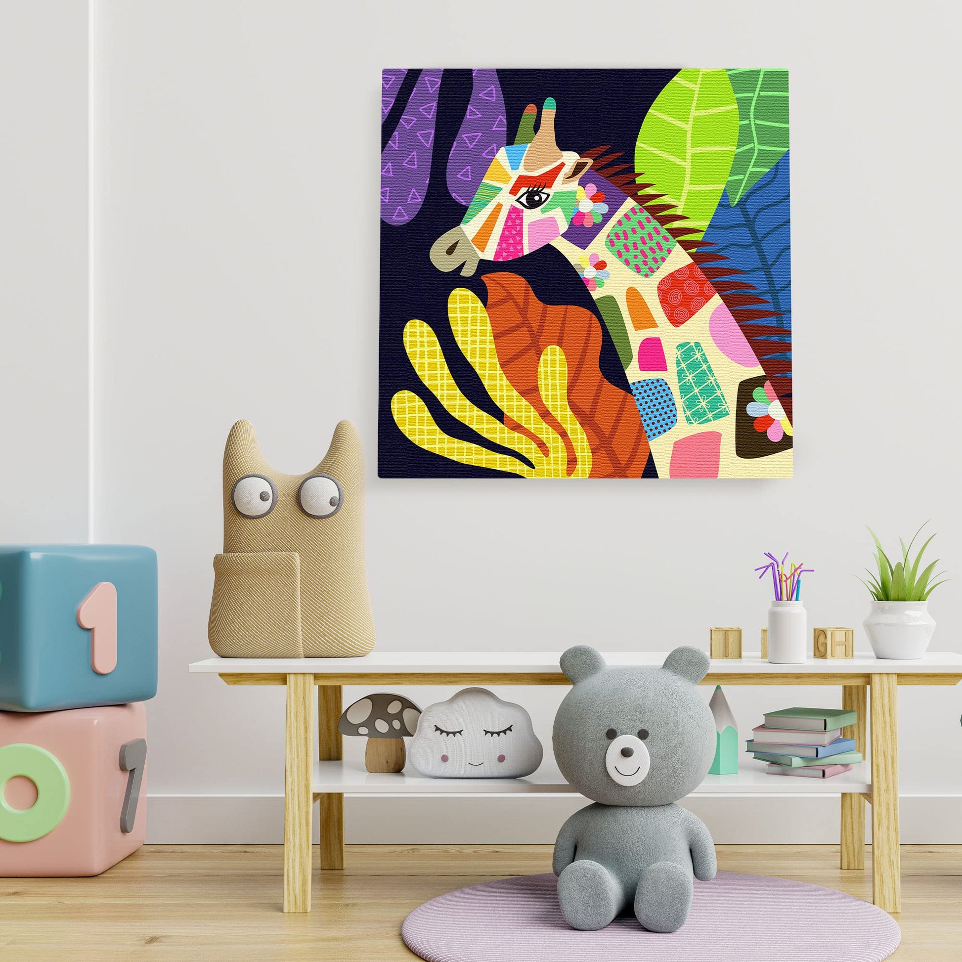 Colorful geometric giraffe head canvas art with vibrant abstract tropical leaves in modern minimalist kids room wall decor setting