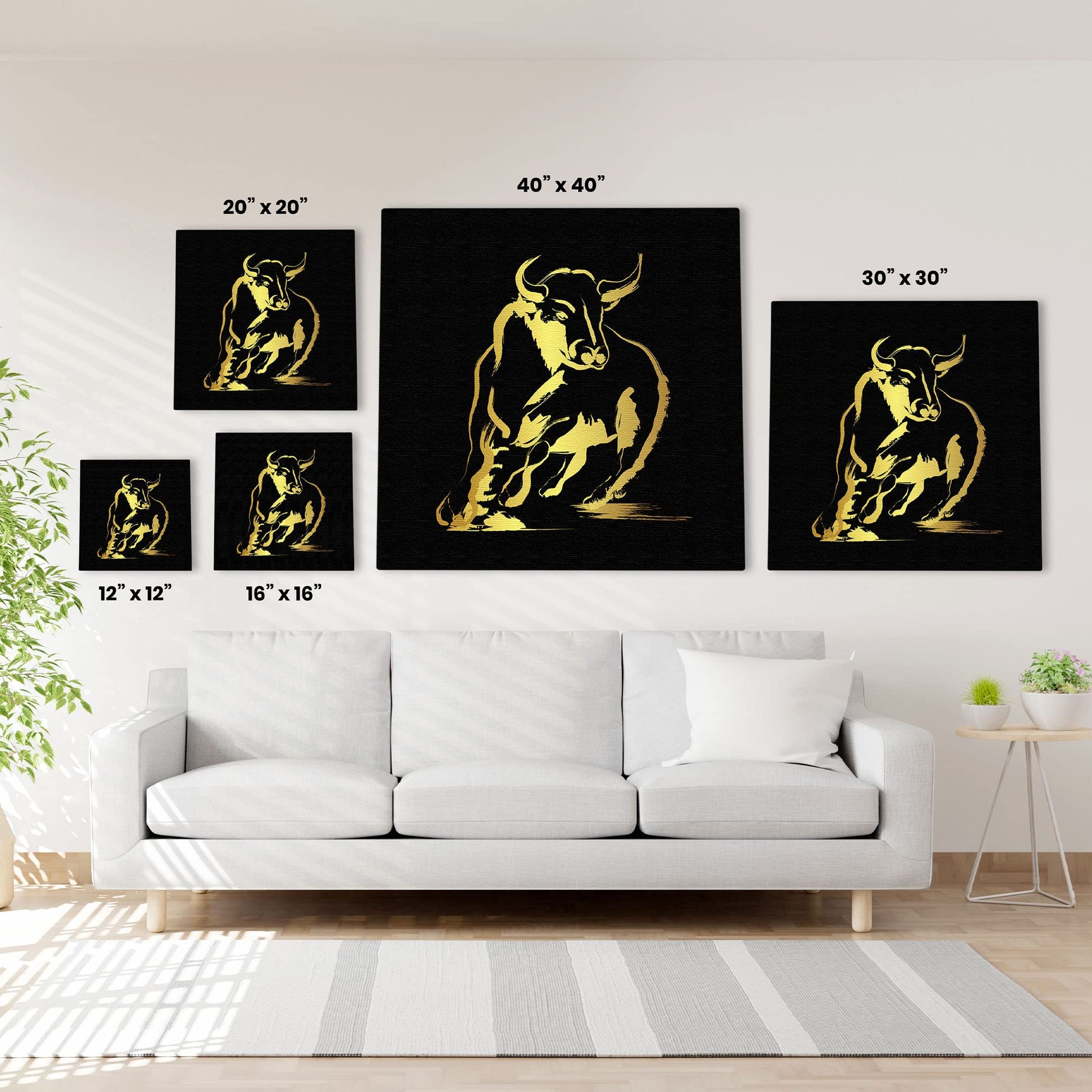 Abstract black and gold bull art in multiple size options displayed on white wall above modern white sofa in living room