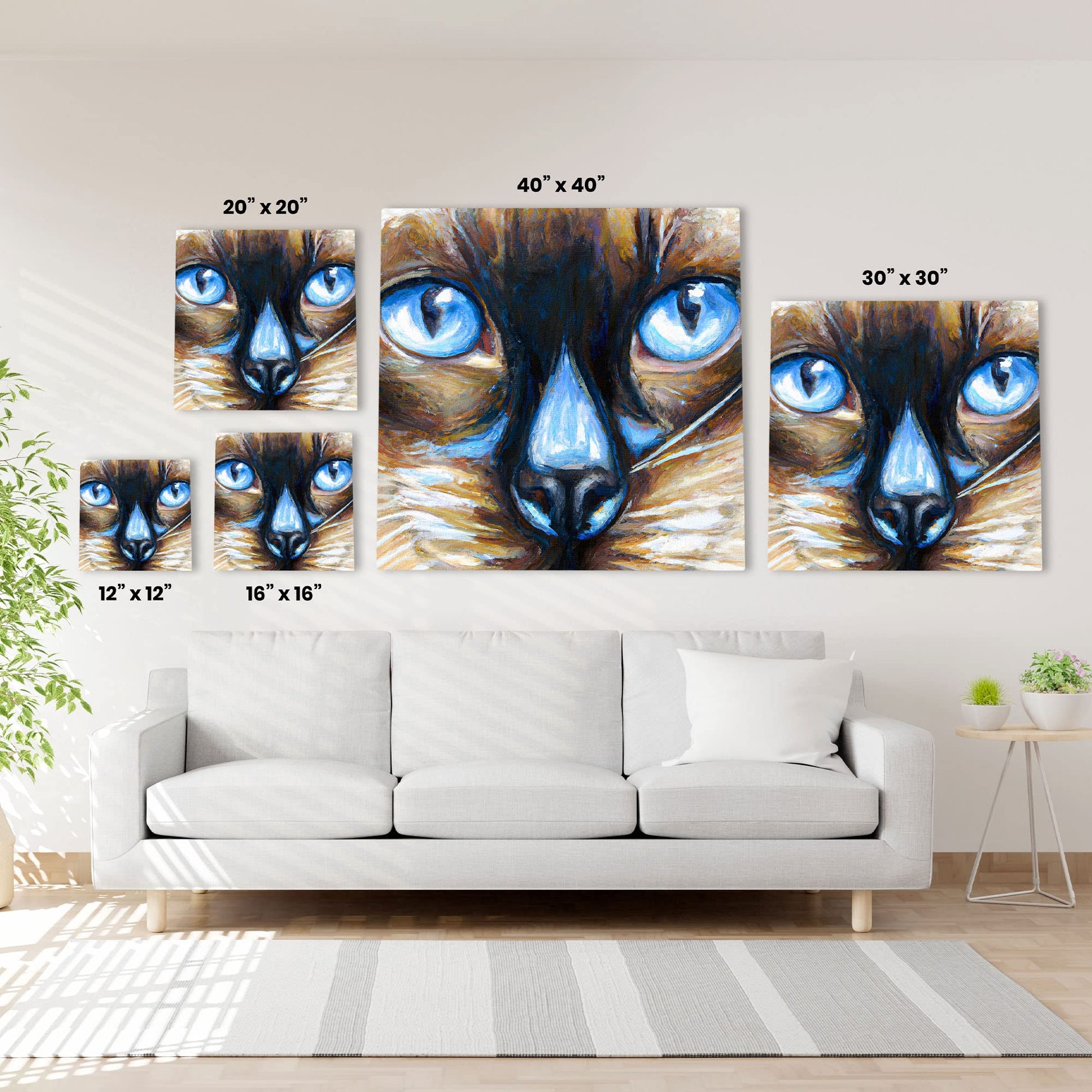 Close-up Siamese cat wall art drawing with vivid bright blue eyes and detailed brush strokes on various sized square canvases above sofa
