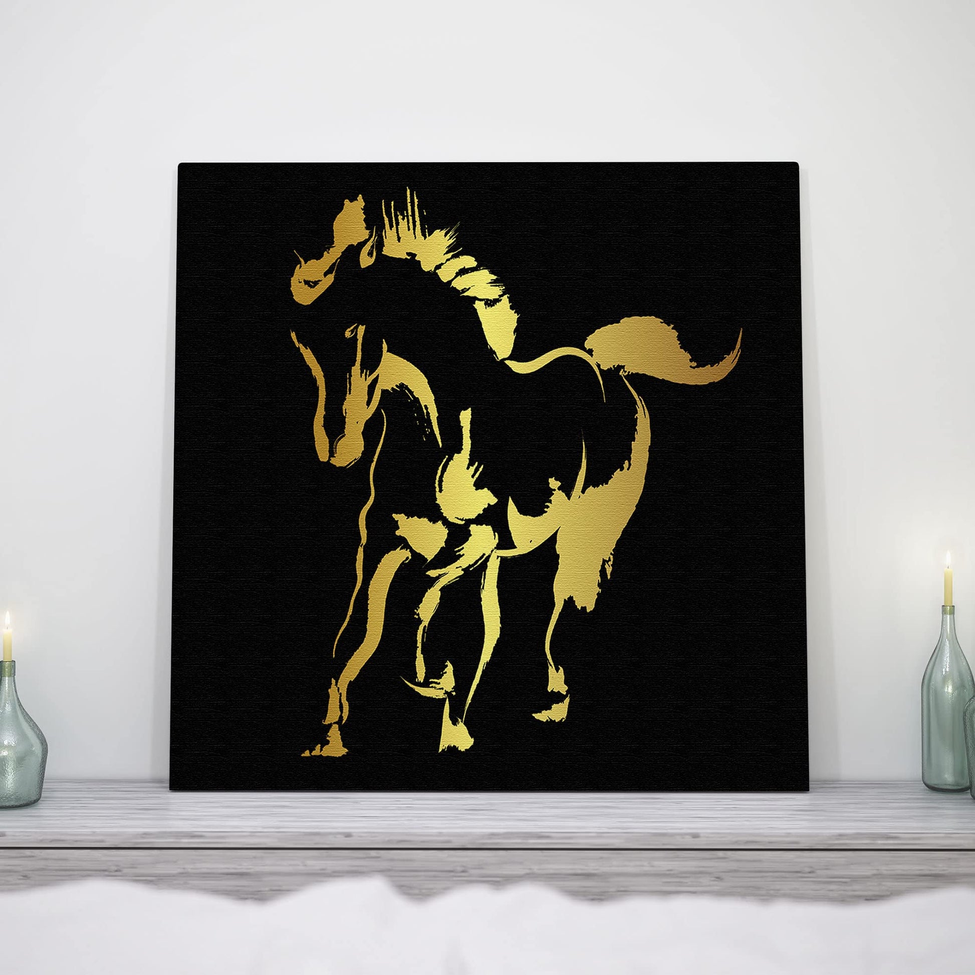 Abstract black and gold silhouette horse art print on textured canvas in modern minimalist shelf display setting