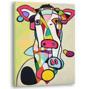 Abstract cow art canvas with bold geometric shapes and vibrant colors on light background displayed angled view