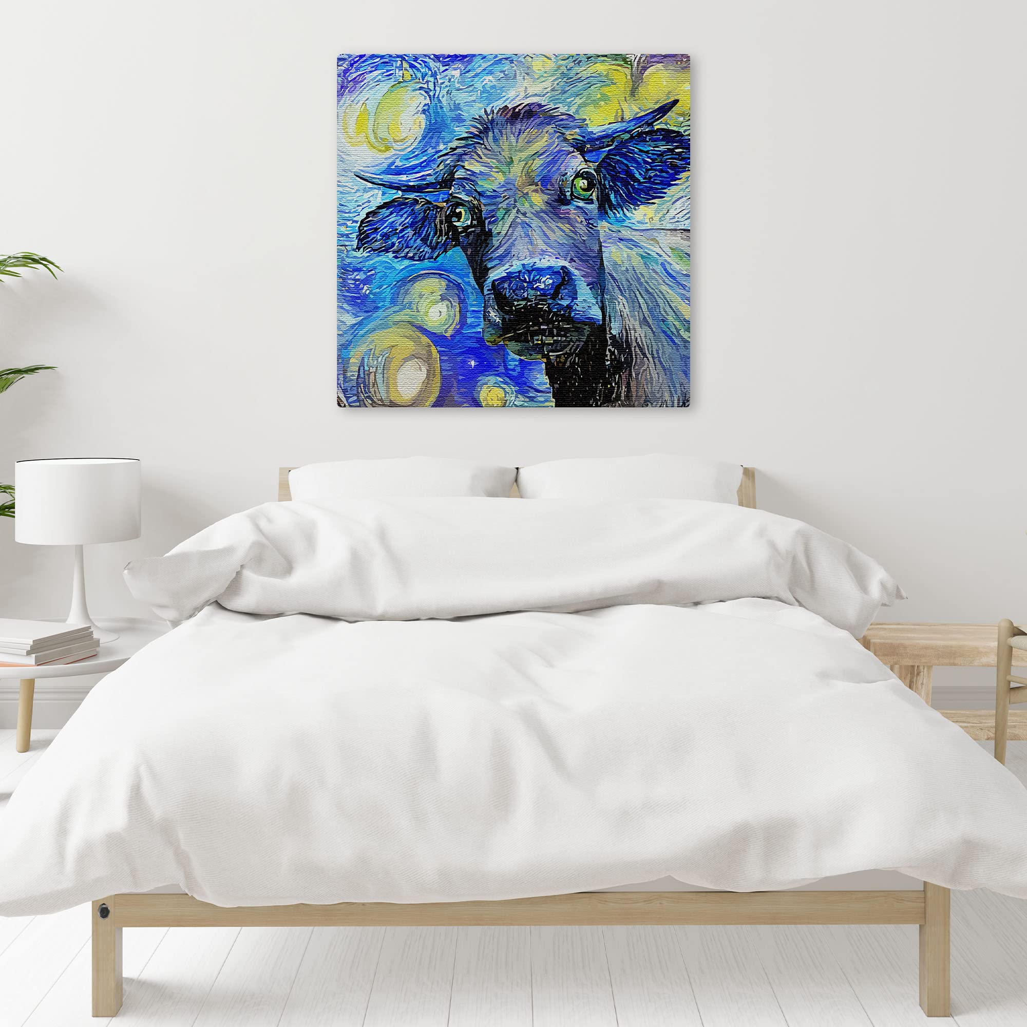 Blue abstract cow painting with vibrant swirling brushstrokes on square canvas displayed above bed in minimalist bedroom