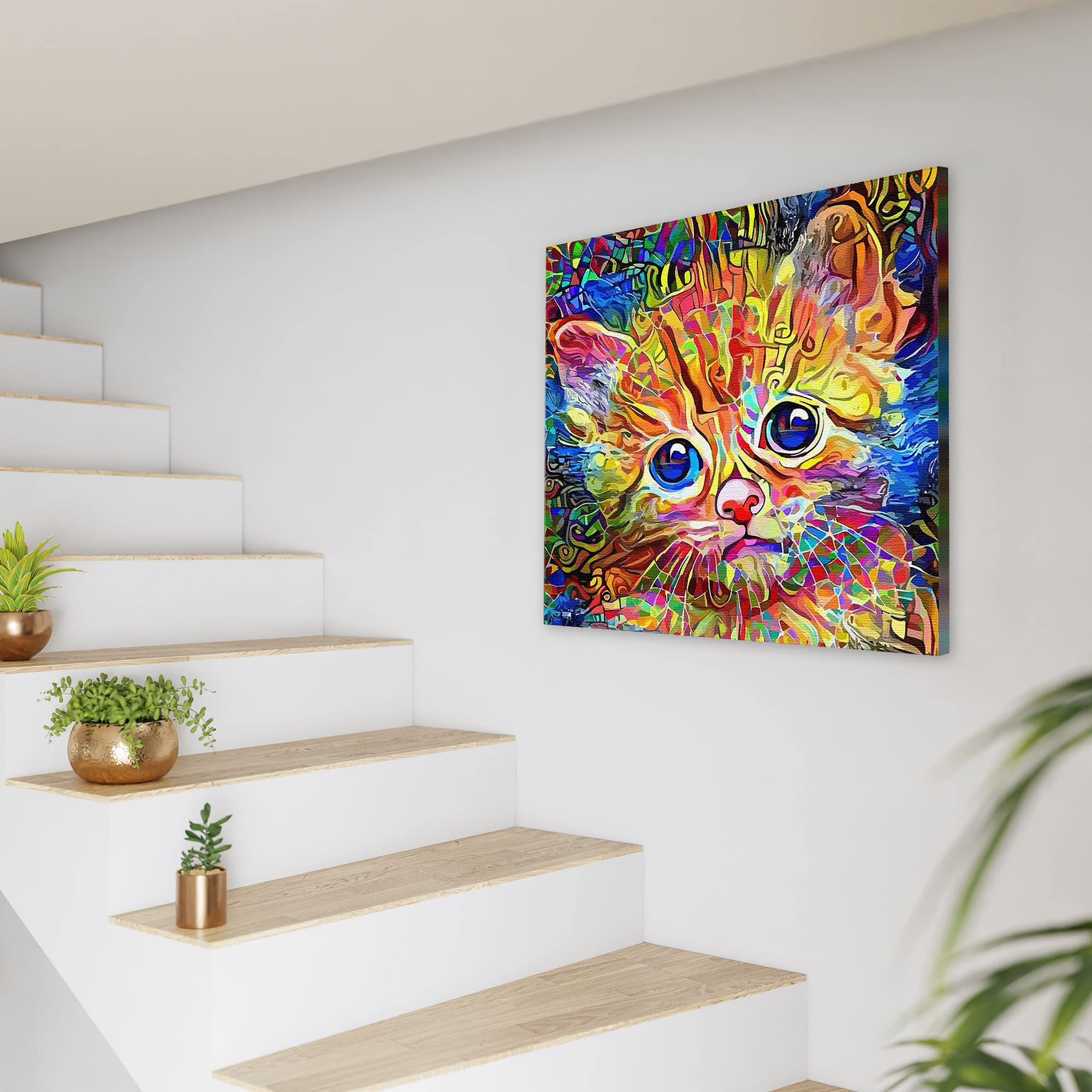 Abstract colorful cat art canvas featuring a wide-eyed kitten with vibrant orange, blue, and green mosaic patterns on white wall background