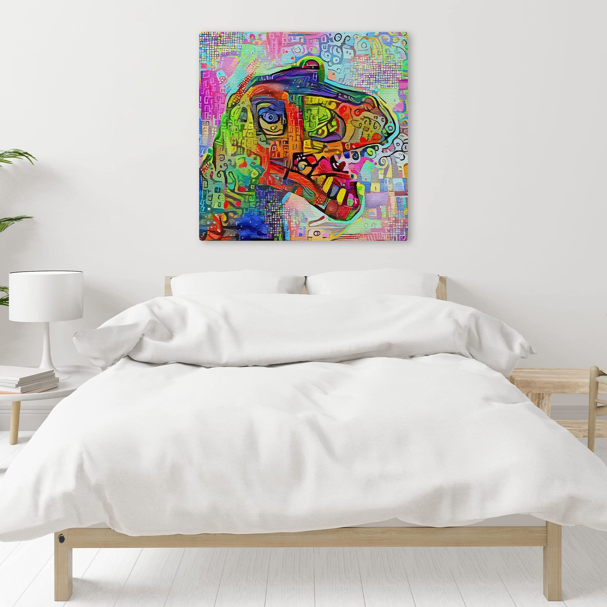 Colorful geometric mosaic T-Rex dinosaur art with vibrant abstract patterns on square canvas above bed in minimalist bedroom