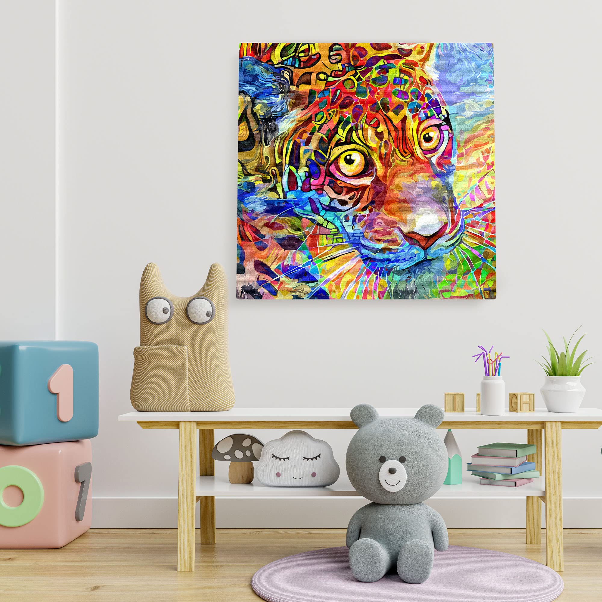 Colorful abstract leopard face wall art with vibrant geometric patterns on textured canvas in playful kids room setting
