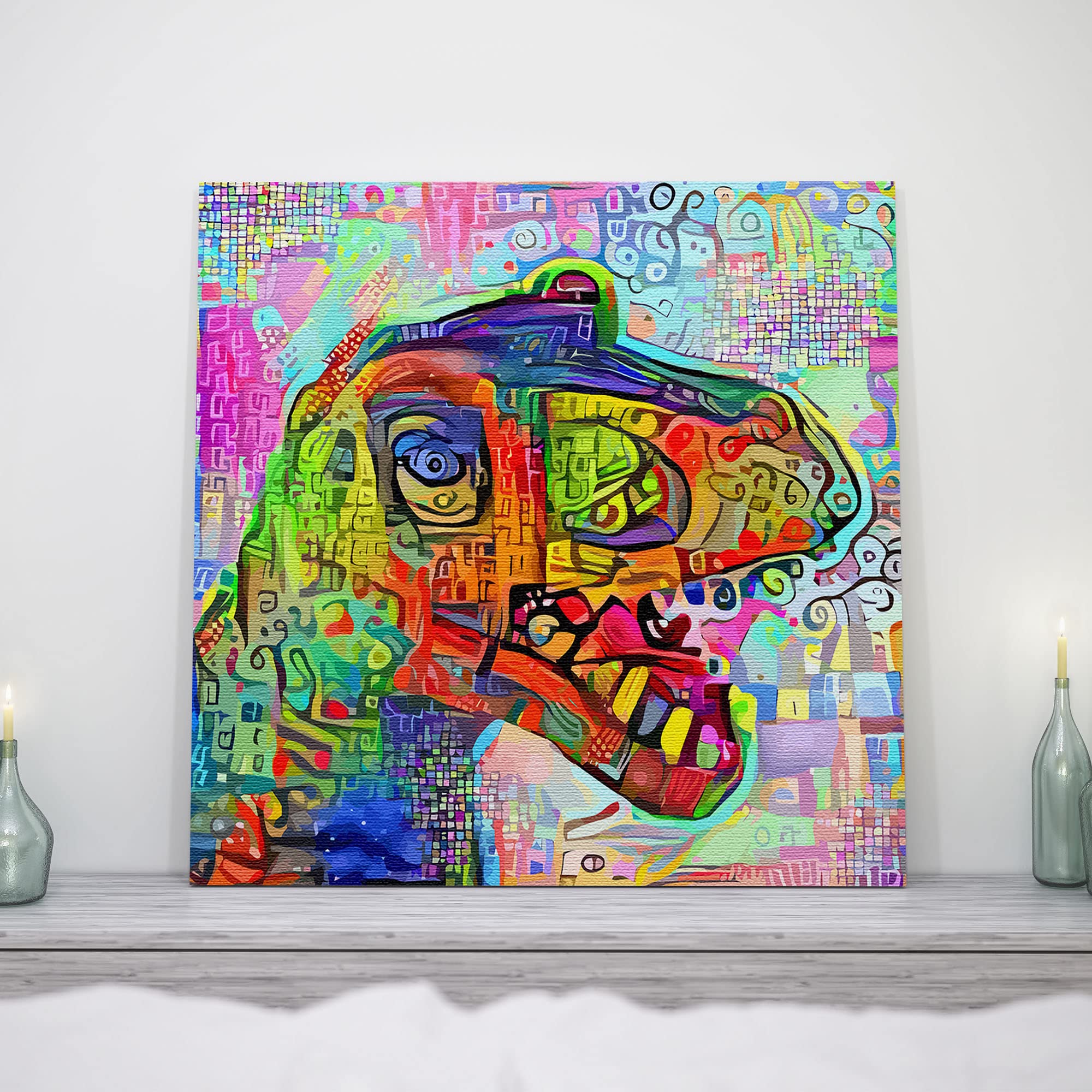 Colorful geometric mosaic T-Rex dinosaur wall art with vibrant abstract patterns on square canvas displayed on white shelf