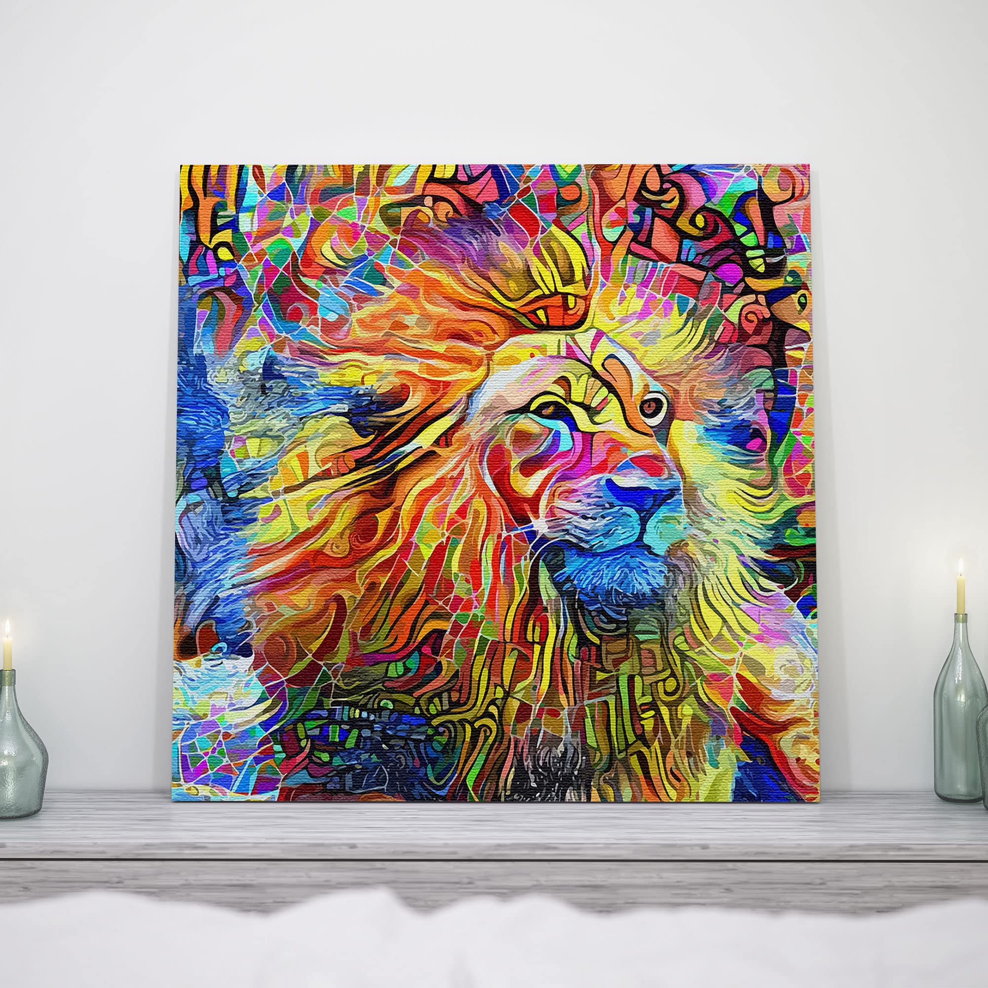 Colorful abstract lion artwork on square canvas displayed on white wall above rustic wooden mantel with glass candle holders