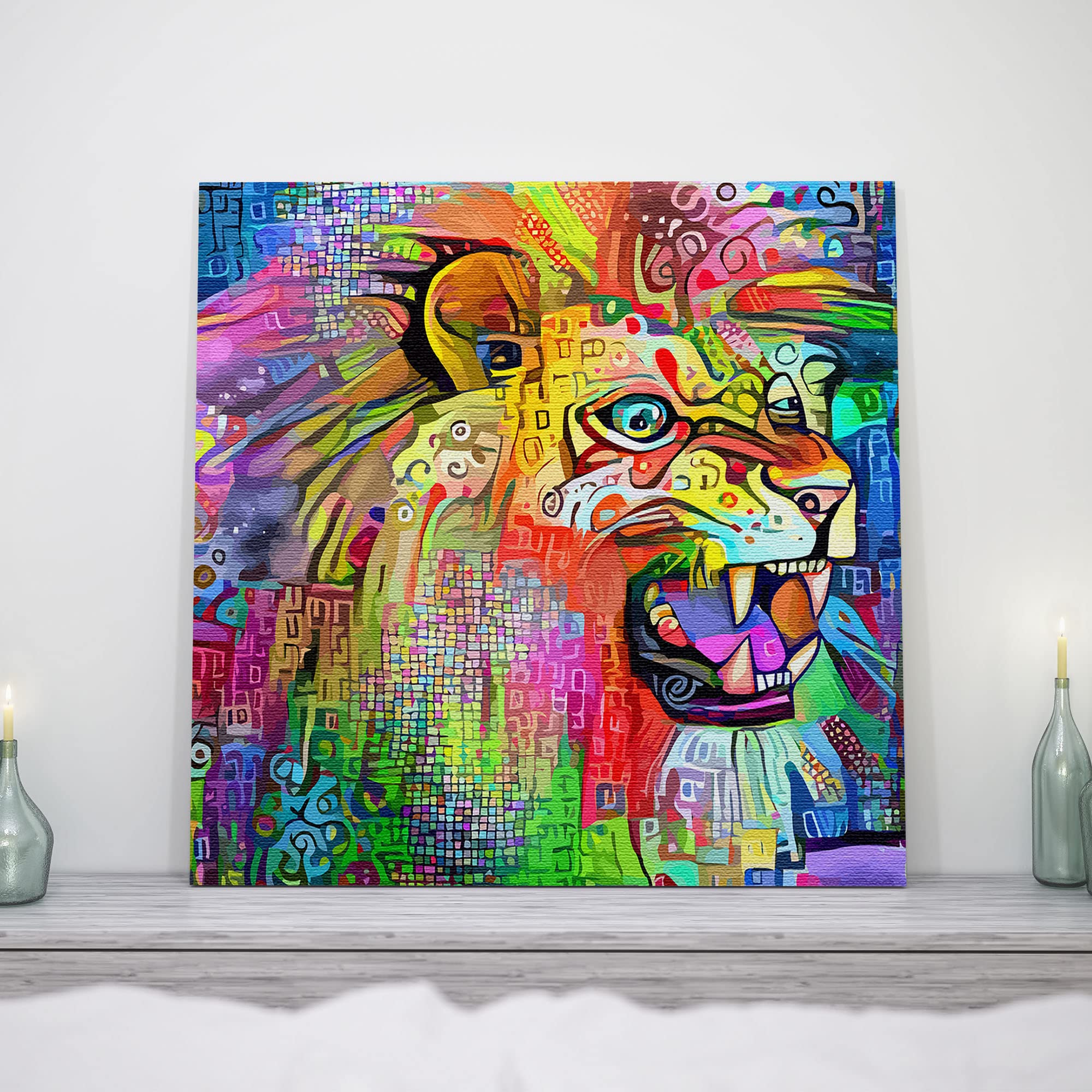 Colorful abstract lion artwork on square canvas displayed on gray shelf with candles on white wall background