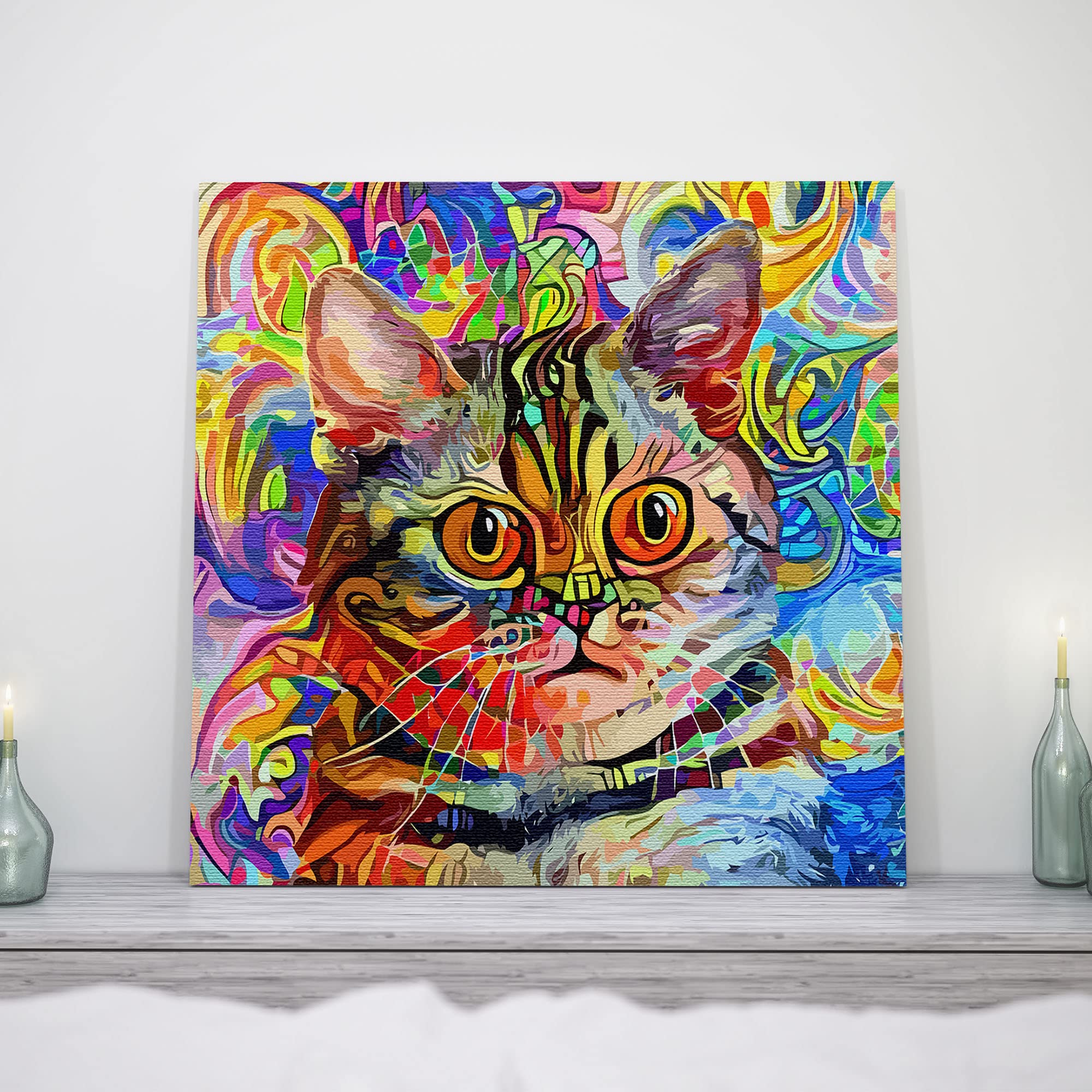 Vibrant watercolor cat wall art with bold colorful abstract patterns and striking orange eyes on bright canvas above mantelpiece