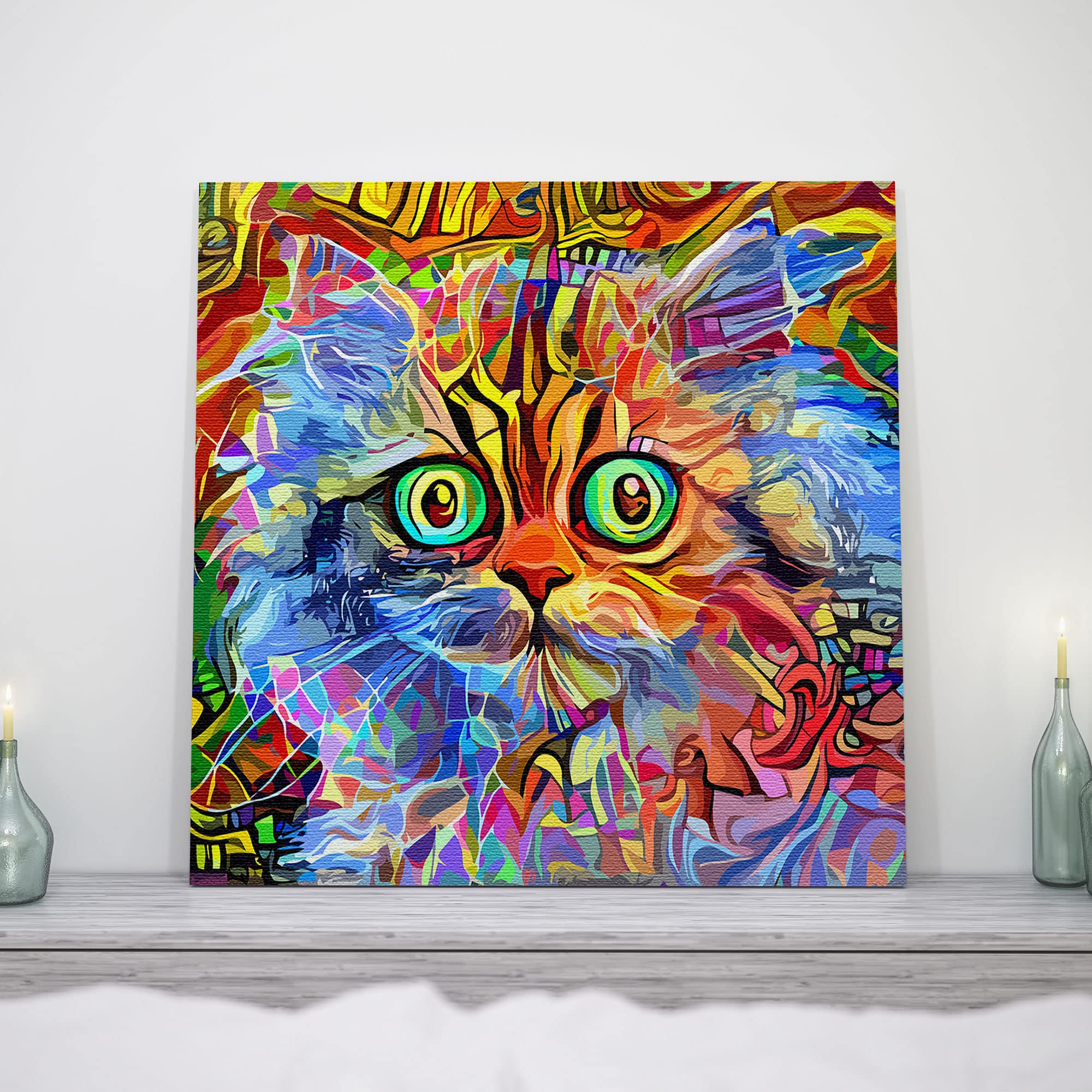 Colorful multicolor cat wall art with bright geometric patterns and large expressive eyes on square canvas above white mantle