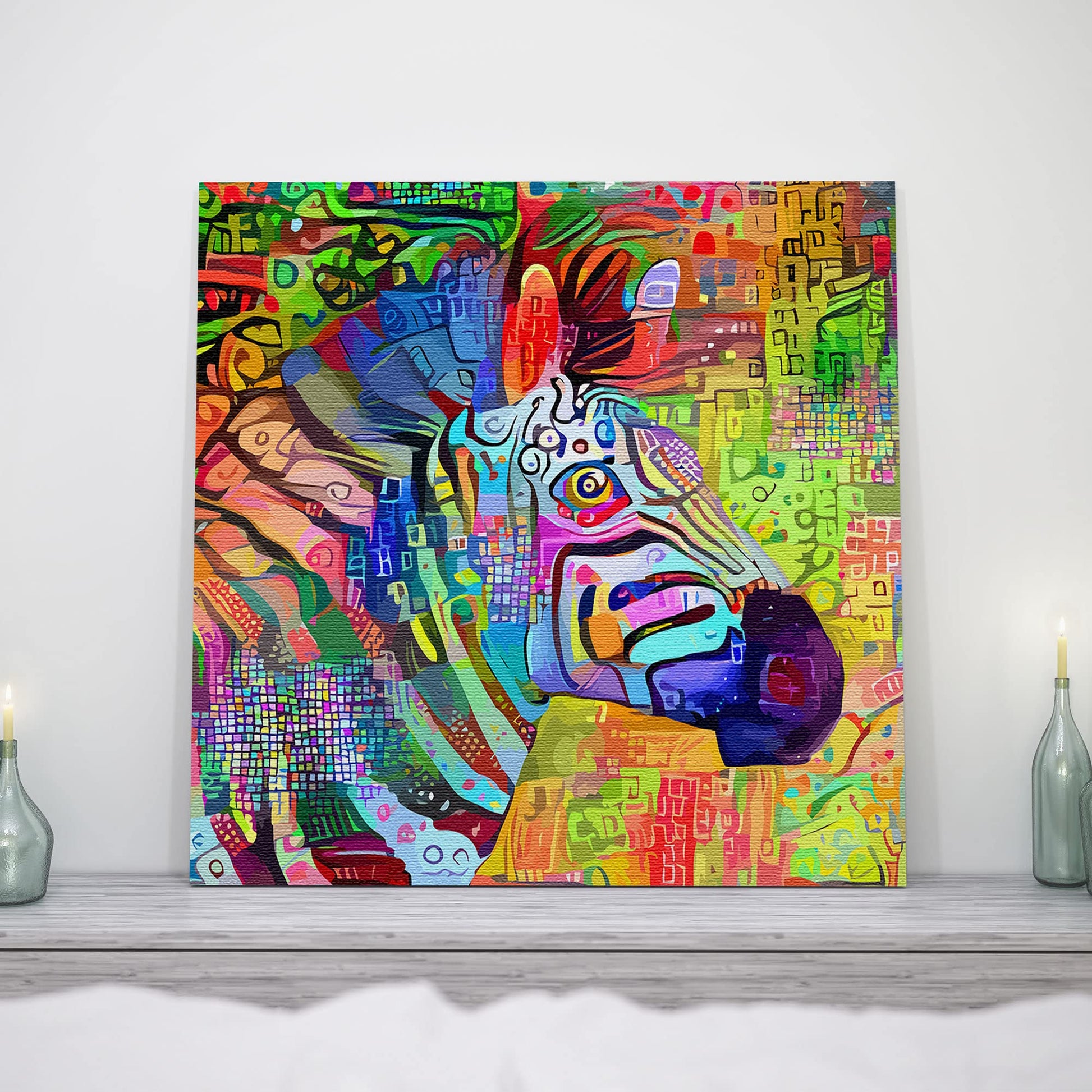 Colorful abstract zebra head with vivid multicolor geometric patterns printed on canvas displayed on wooden shelf with candles