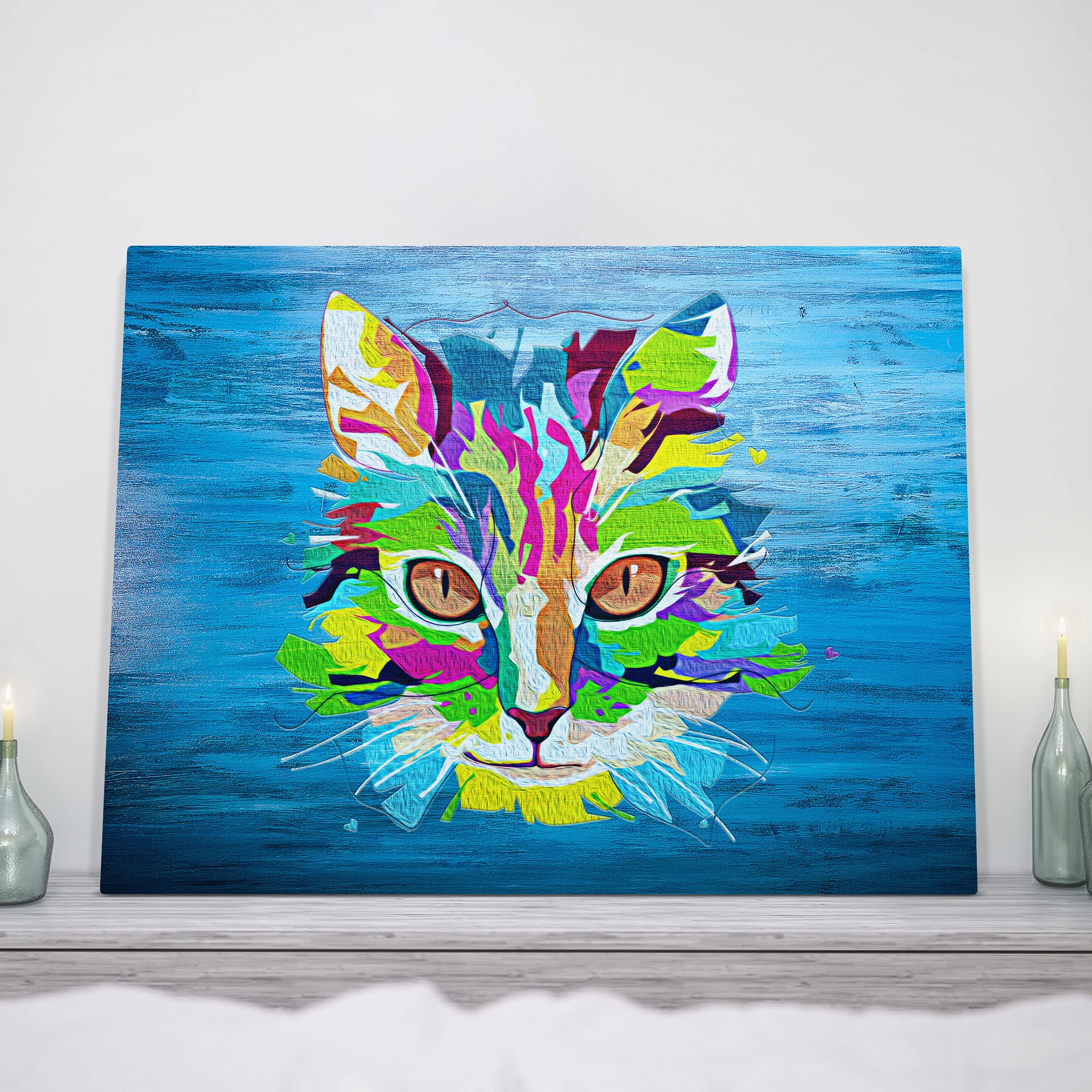 Blue pop art cat wall art with vibrant multicolor geometric shapes and bold lines on textured blue canvas above mantel